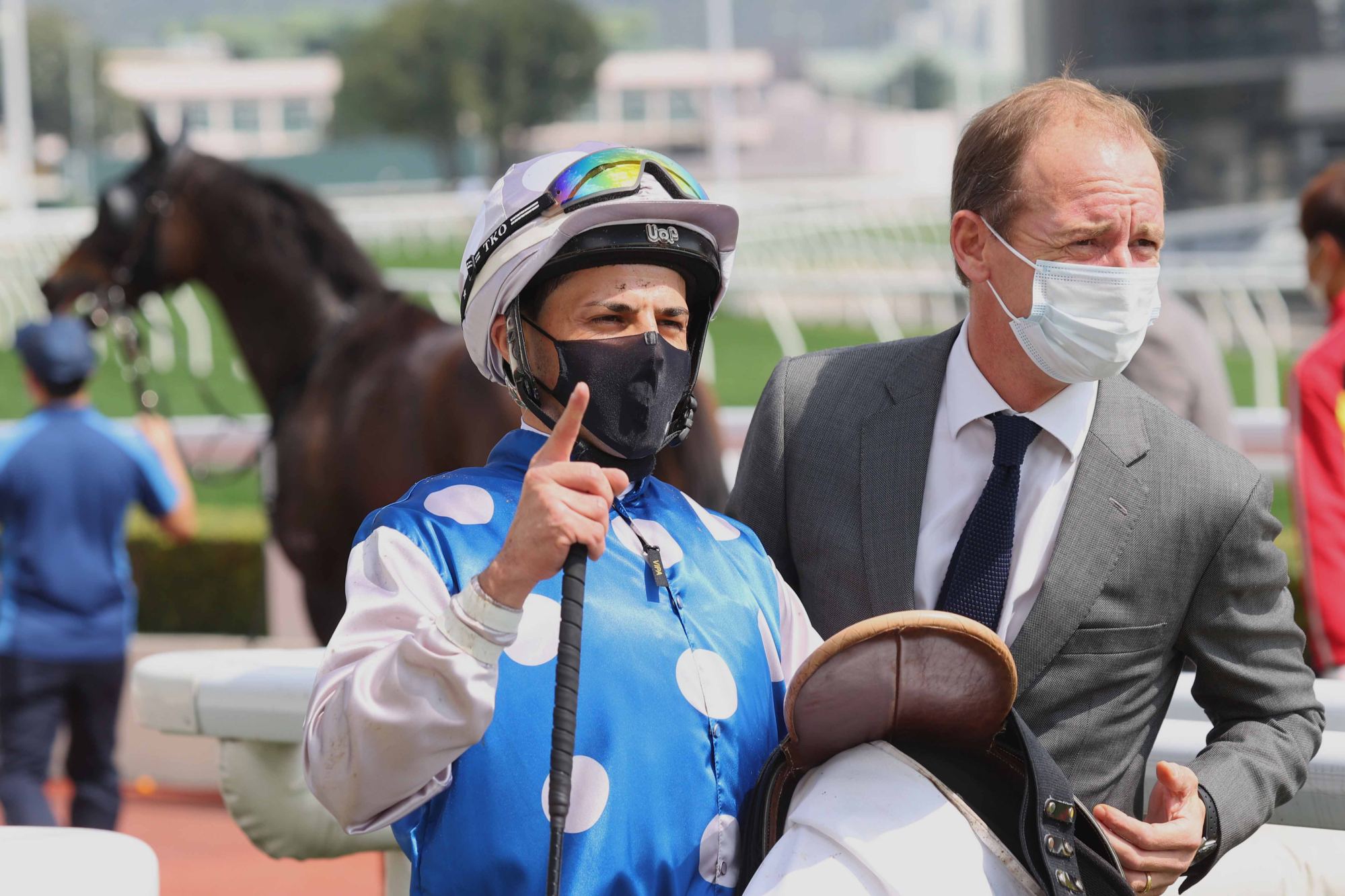 Jockey Ruan Maia and trainer Richard Gibson celebrate Right Honourable’s upset $75 win at Sha Tin on February 12.