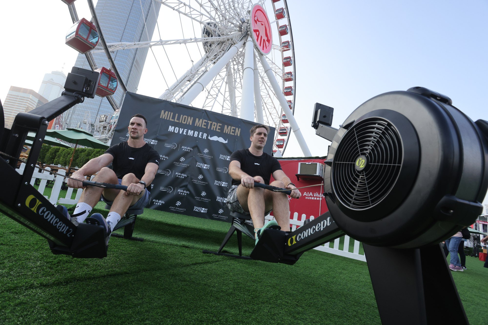 From left: Ben Cullen and George Fleming are on a mission to row a million metres in a month on rowing machines at landmarks across Hong Kong for Movember. Photo: Jonathan Wong