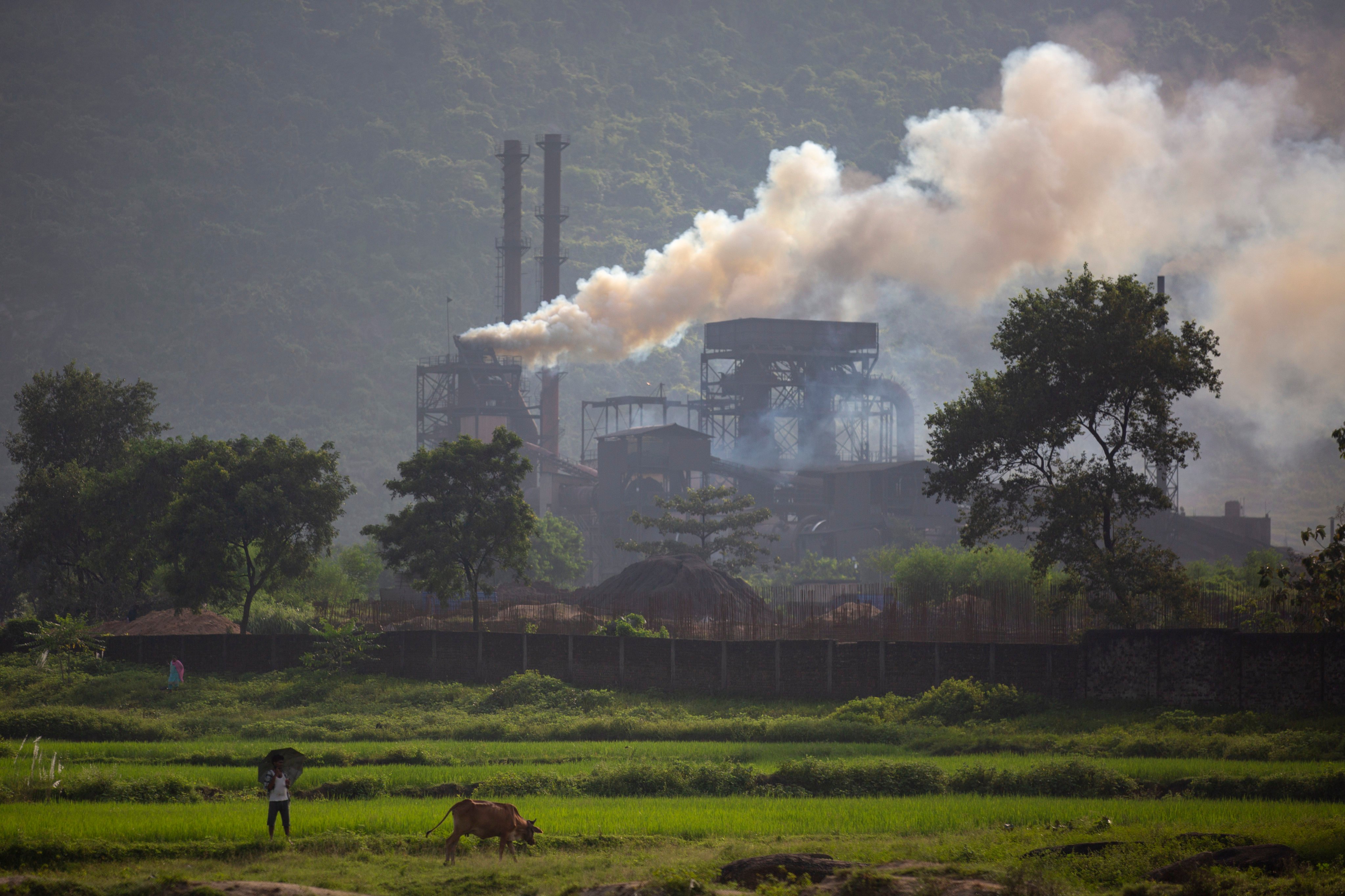 Smoke rises from a coal-powered steel plant at Hehal village near Ranchi, in eastern Jharkhand state, in India. The key priority for India at the upcoming UN climate conference will be how to pay for the transition away from fossil fuels for energy and industries to meet temperature-limit targets, according to a senior official who will be part of the negotiations. Photo: AP