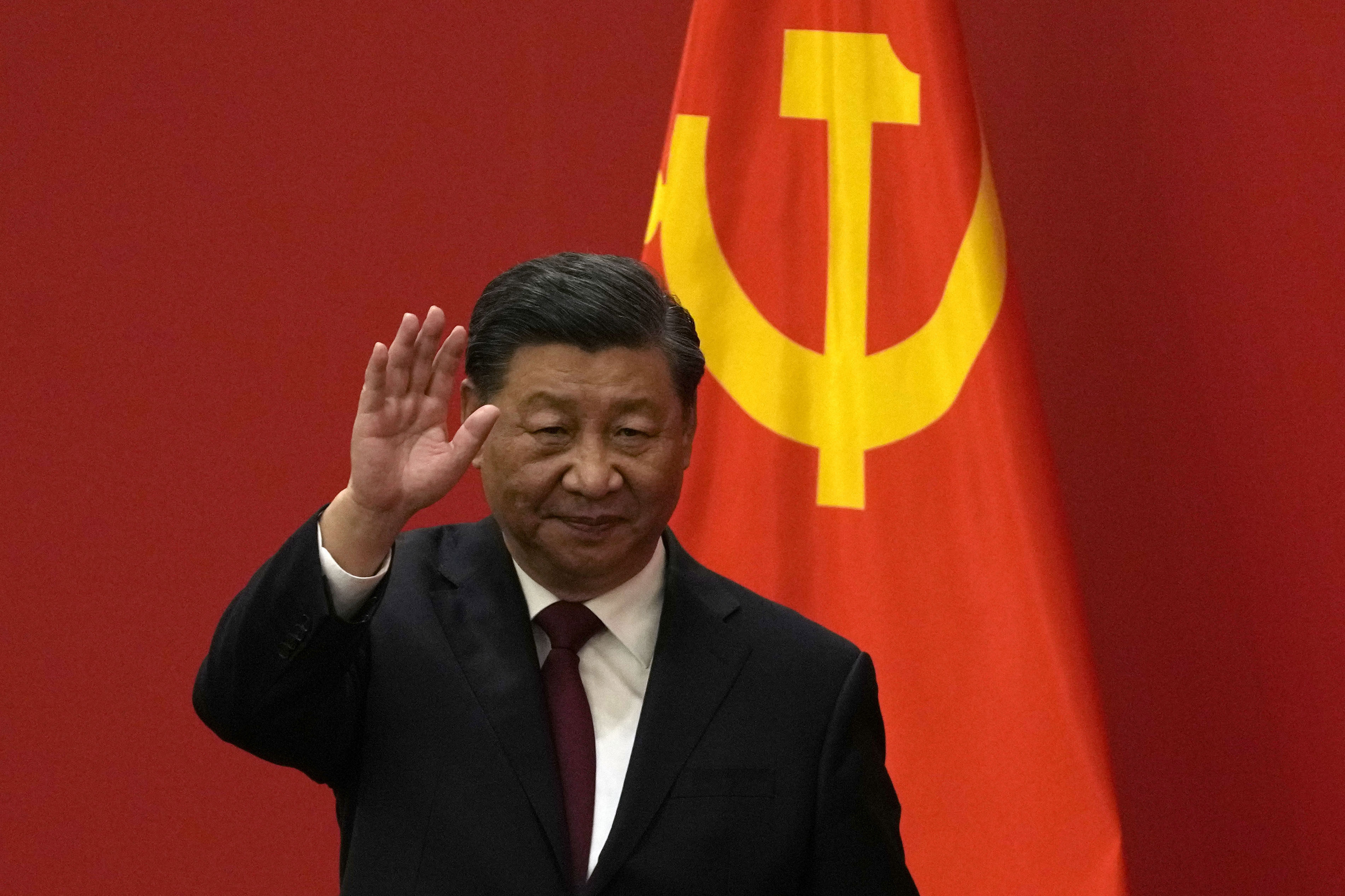 Chinese President Xi Jinping waves at an event to introduce new members of the Politburo Standing Committee at the Great Hall of the People in Beijing on October 23. Western commentary on Xi’s appointment is rather self-regarding, considering that in America, term limits for presidents are a relatively recent measure. Photo: AP