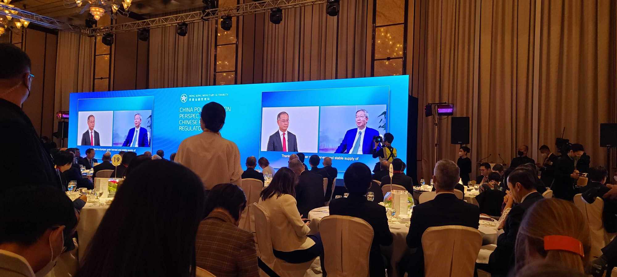 A pre-recorded dialogue between the Hong Kong Monetary Authority’s chief executive Eddie Yue Wai-man (left) and the People’s Bank of China governor Yi Gang (right), during the Global Financial Leaders’ Investment Summit at the Four Seasons Hotel in Hong Kong’s Central district on November 2, 2022. Photo: Enoch Yiu.