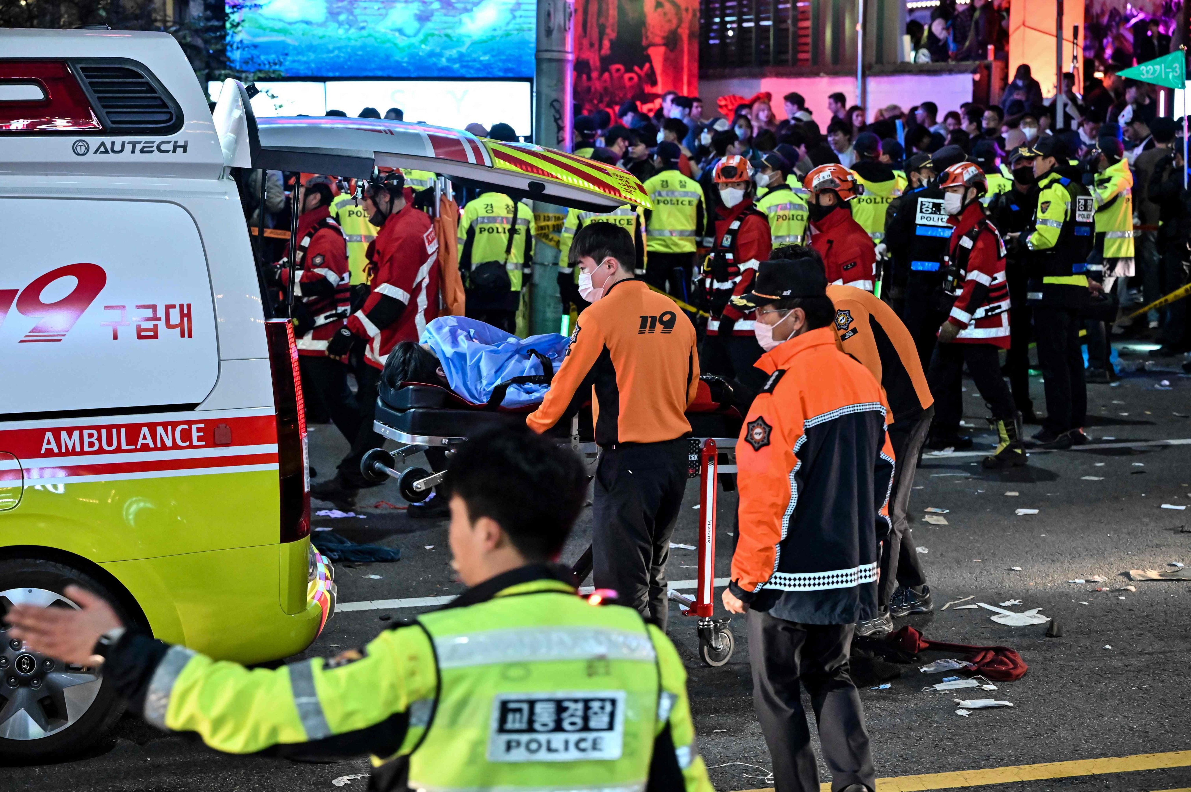 Paramedics attend to a victim believed to have suffered cardiac arrest in the popular nightlife district of Itaewon in Seoul on October 30. Photo: AFP