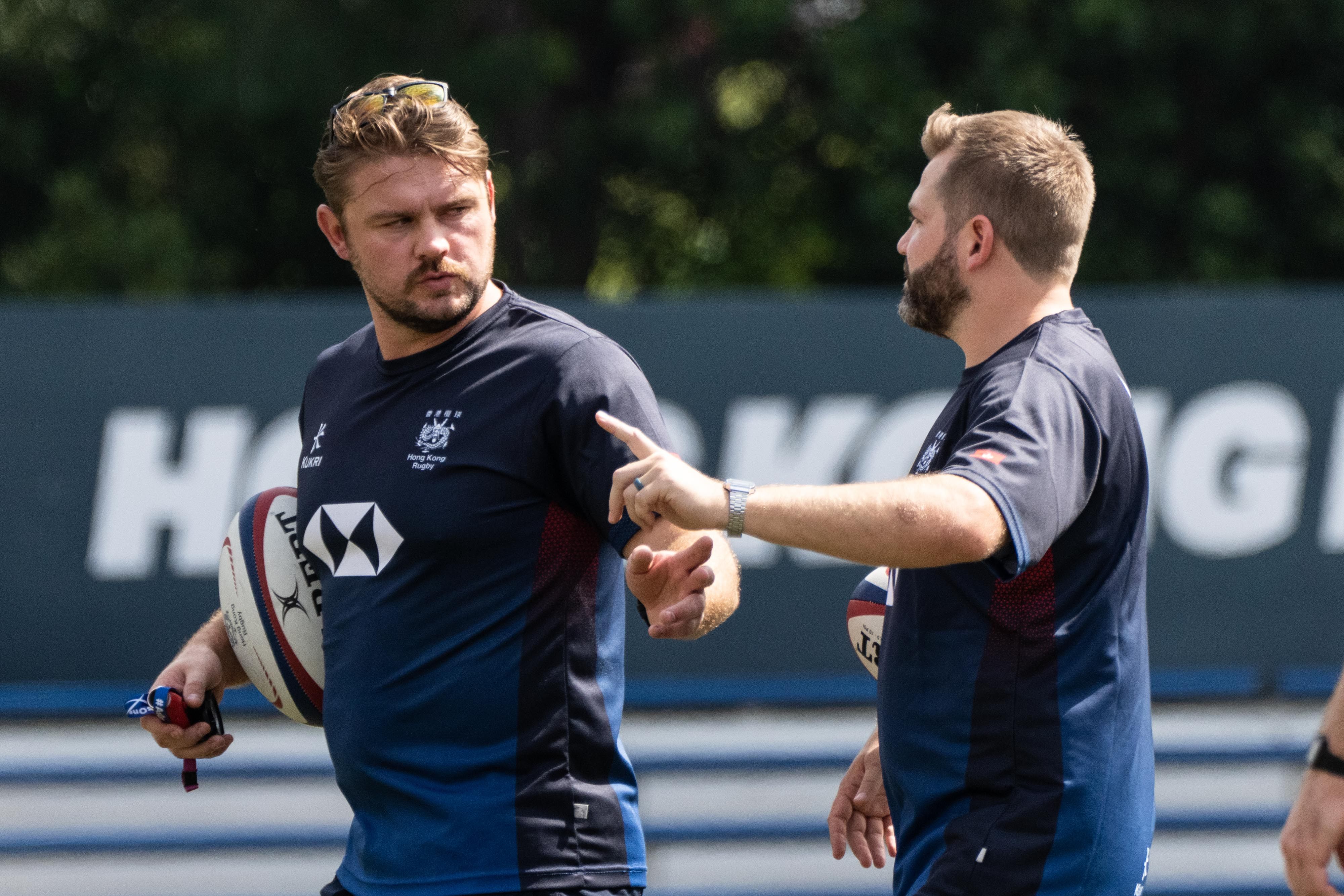 Hong Kong head coach Lewis Evans (right) chats with backs coach Joe Barker at a training session at King’s Park before the team left for Dubai. Photo: HKRU