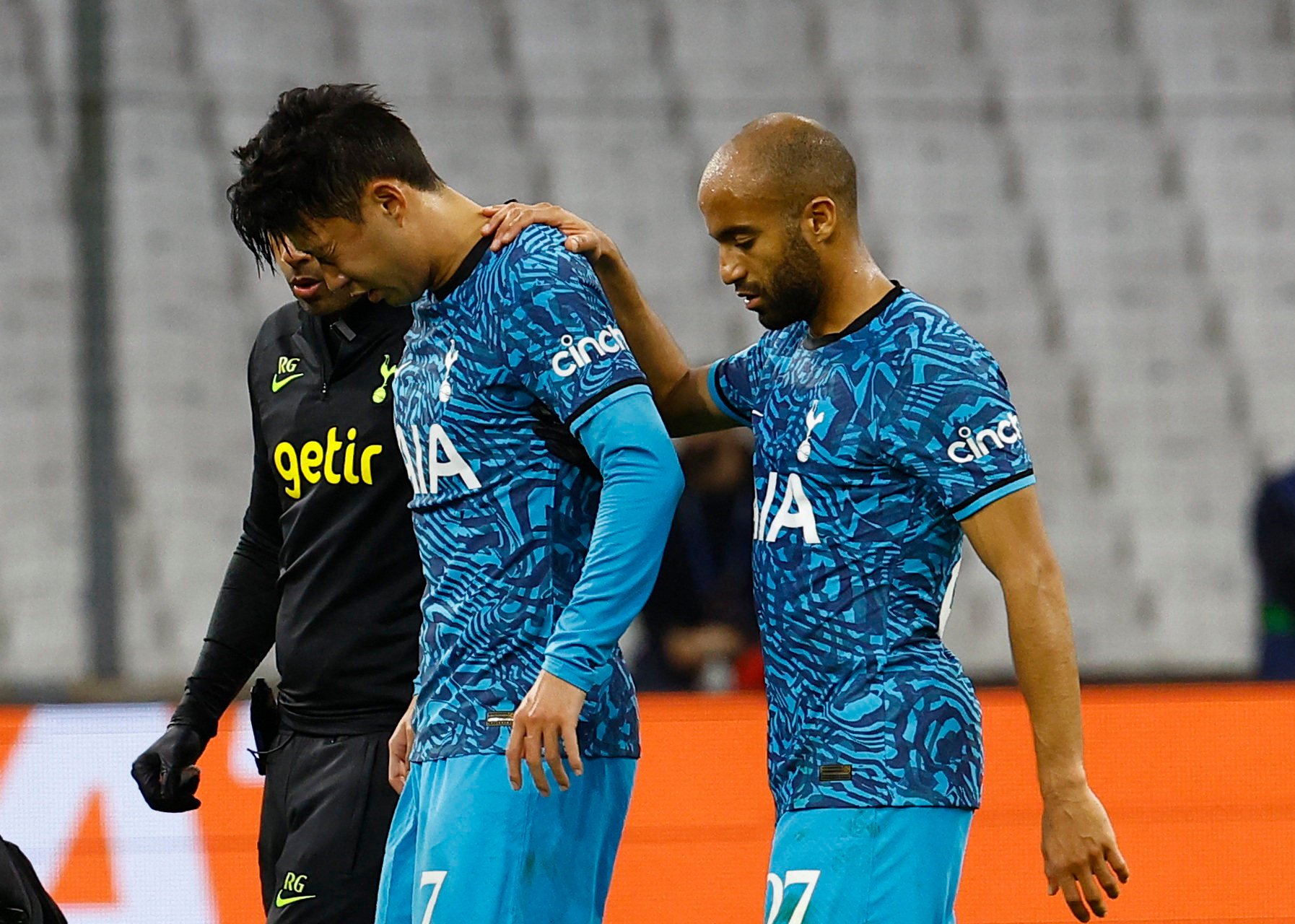 Hotspur’s Son Heung-min is helped off the pitch by Lucas Moura after sustaining an injury. Photo: Reuters
