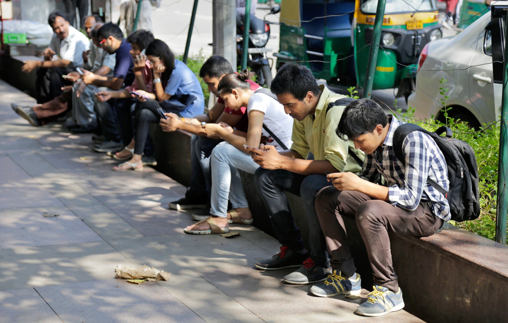 People use their mobile phones in New Delhi, India. File photo: AP