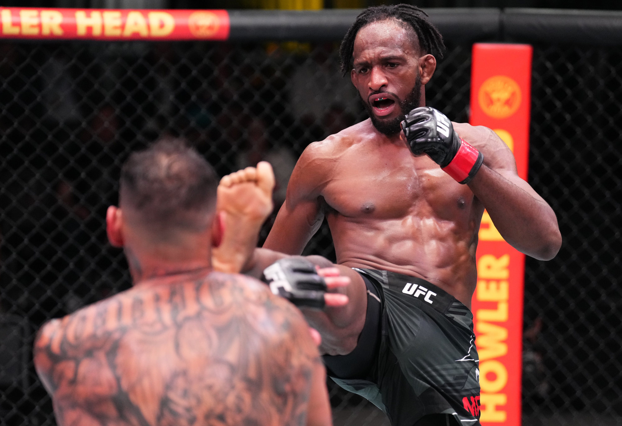 Neil Magny kicks fellow Daniel Rodriguez in a welterweight fight on November 5, 2022 in Las Vegas, Nevada. Photo: Zuffa LLC/Getty Images