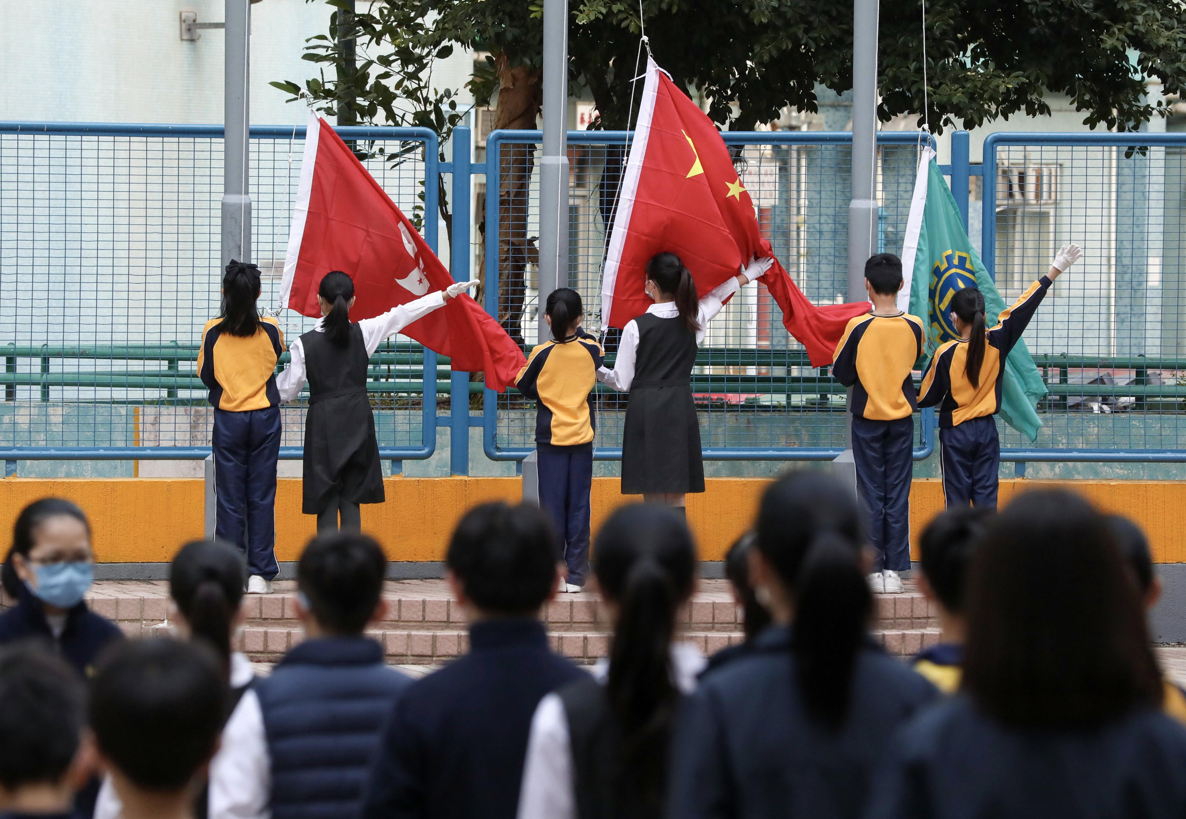 National education activities, such as flag-raising ceremonies, are to instil a sense of identity in students, a minister has said. Photo: Jonathan Wong
