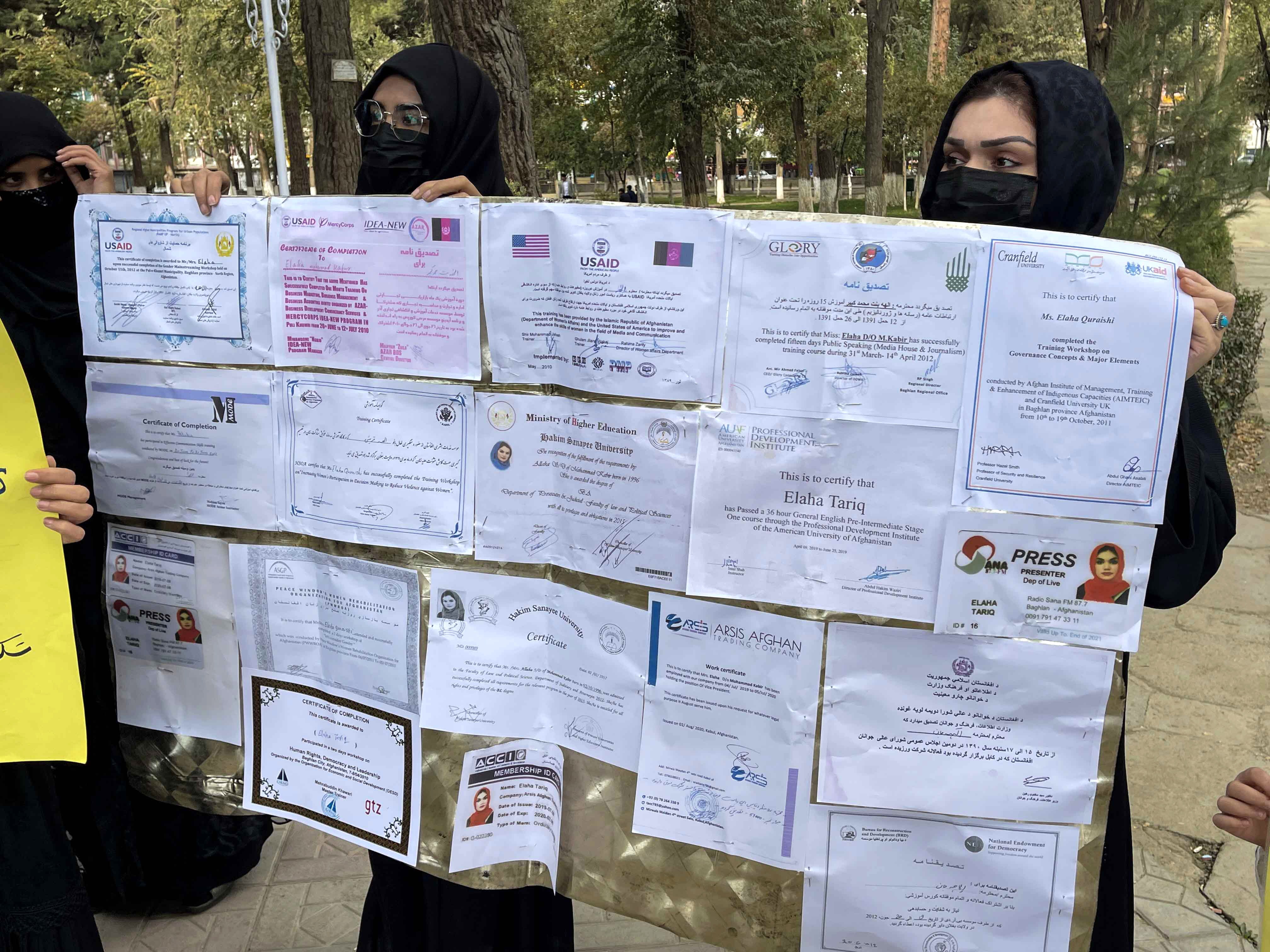 Afghan women hold their educational documents during a protest as they demand the Taliban government provide them with job opportunities in Kabul, Afghanistan, on October 31. The Taliban have banned women from many government jobs and forbidden secondary school education for girls.  Photo: EPA-EFE