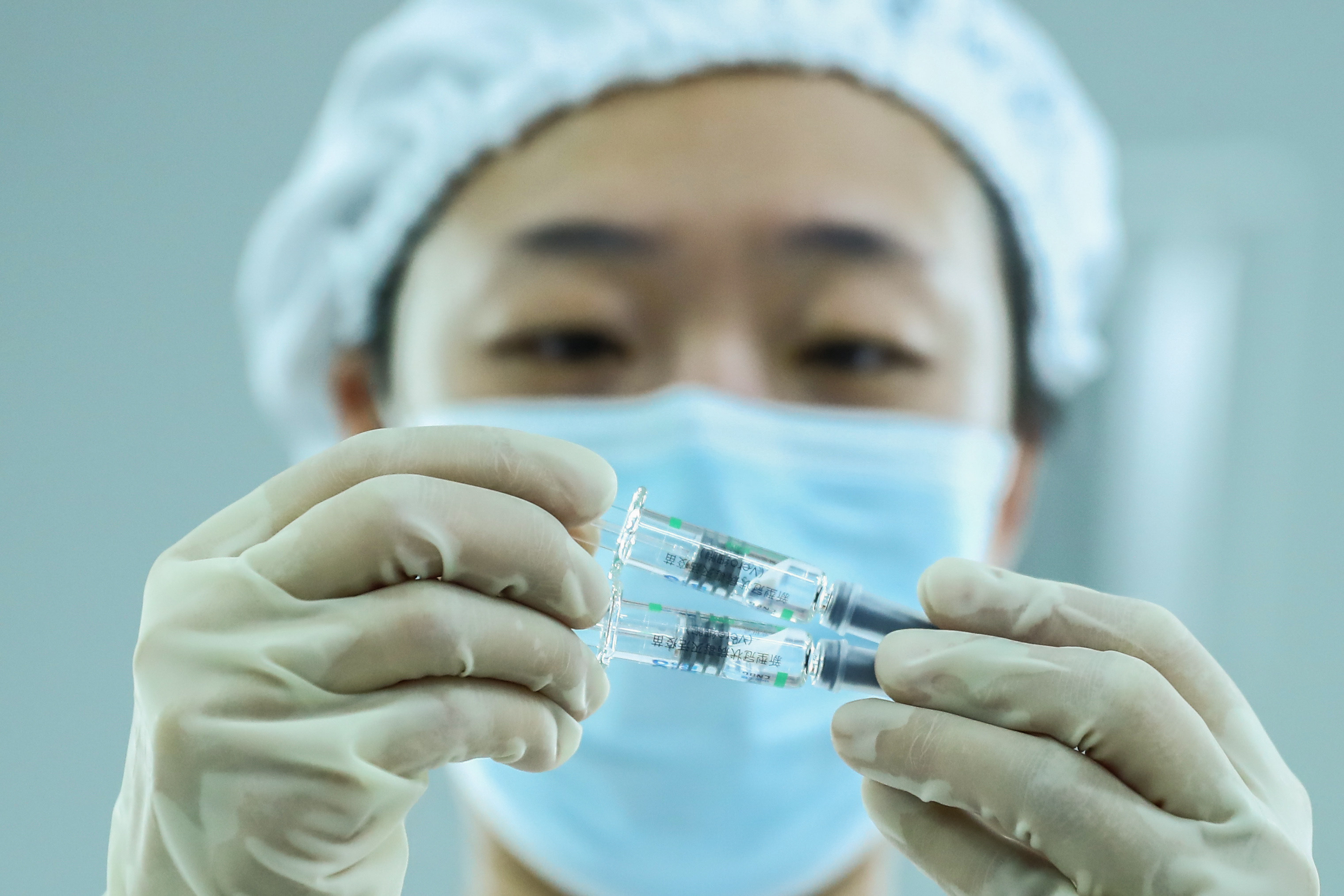 A worker checks the packaging quality of Covid-19 vaccine products at a packaging plant in Beijing on December 25, 2020. Photo: Xinhua