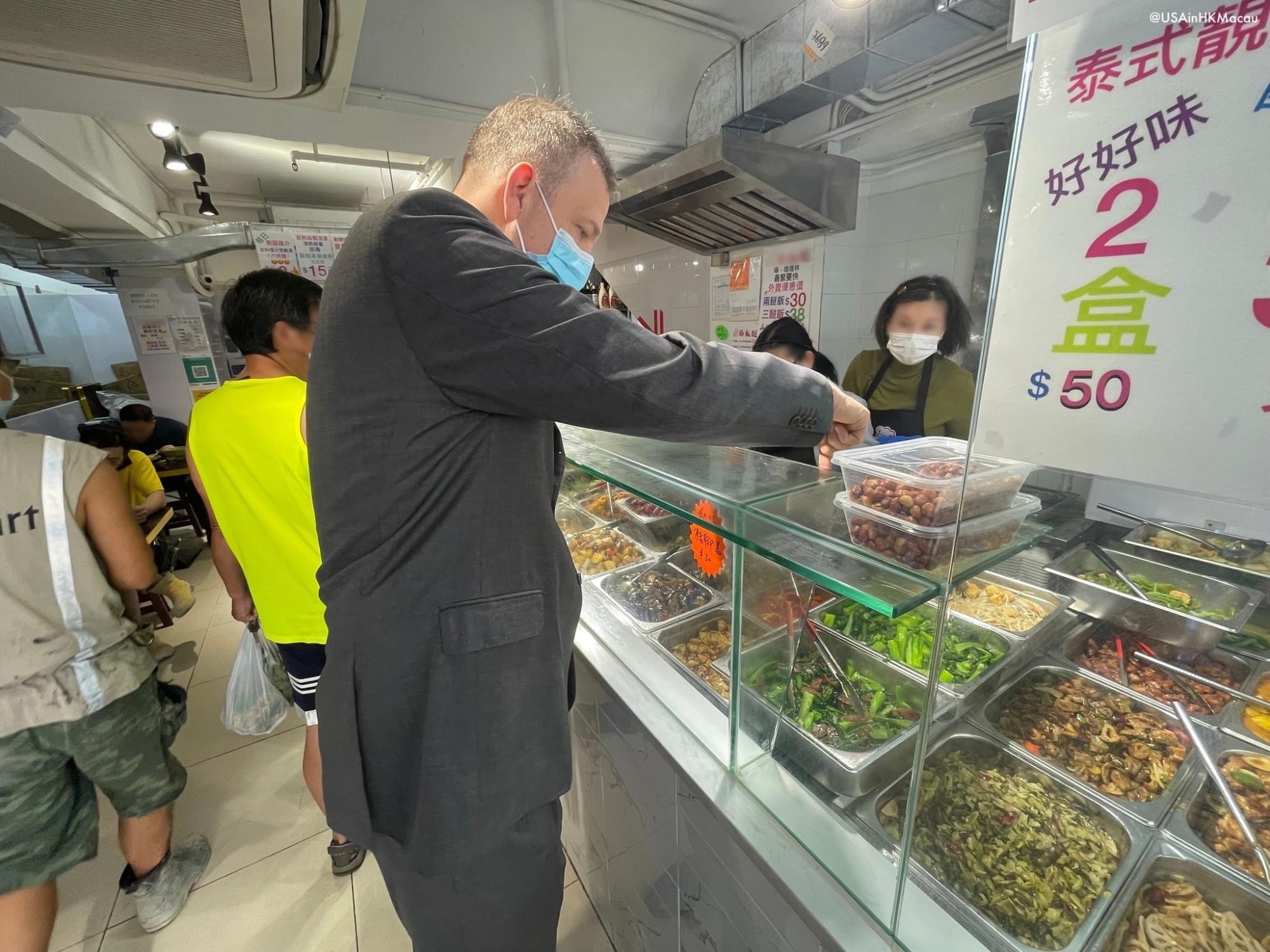 US Consul General Gregory May bought his “two-dish-rice” box in Central and documented it on Facebook. Photo: Facebook/US Consulate General Hong Kong and Macau