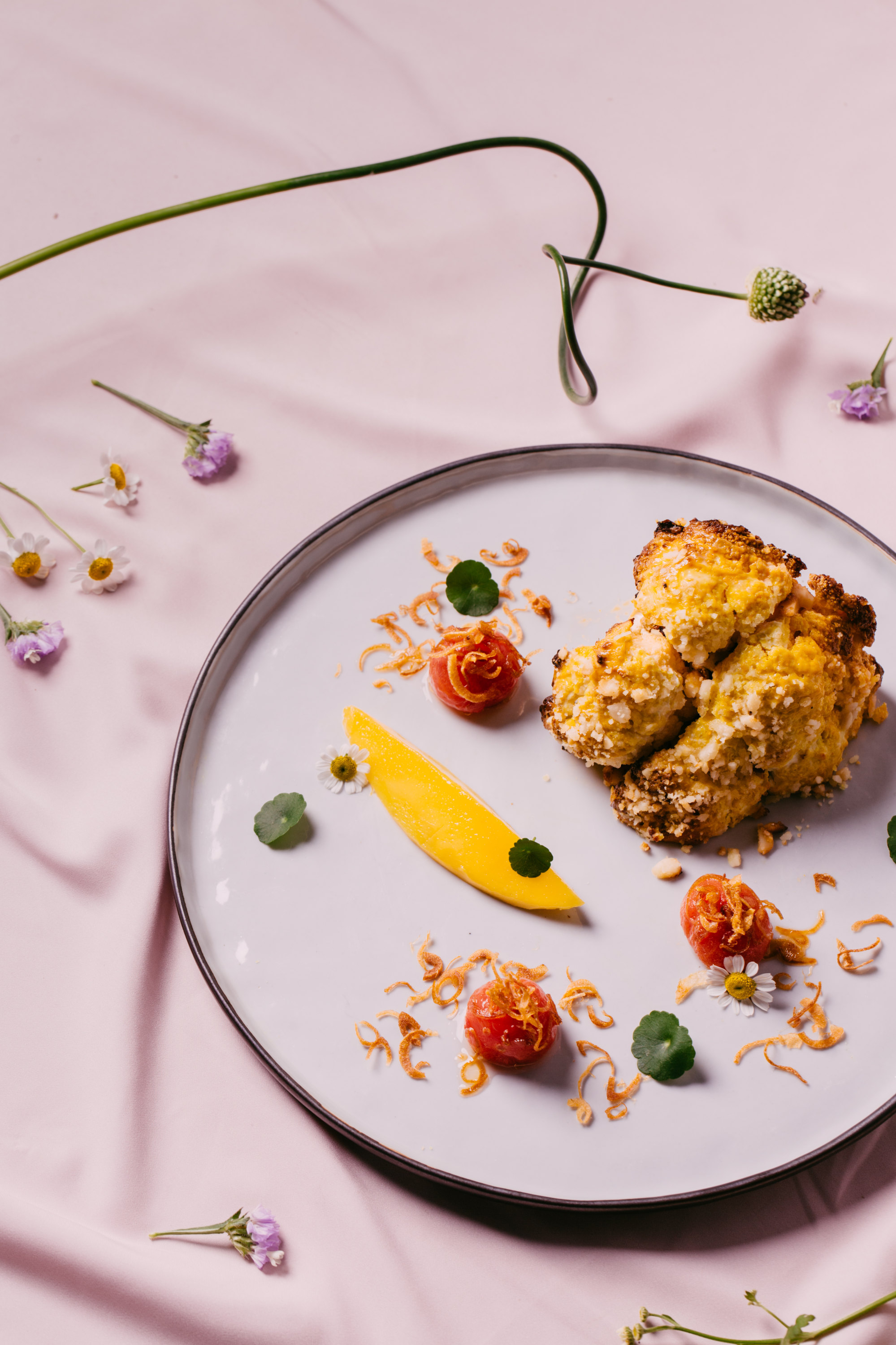 Harissa cauliflower with mango, as served at Tan’s dining club, Otium. Photo: Stephanie Teng