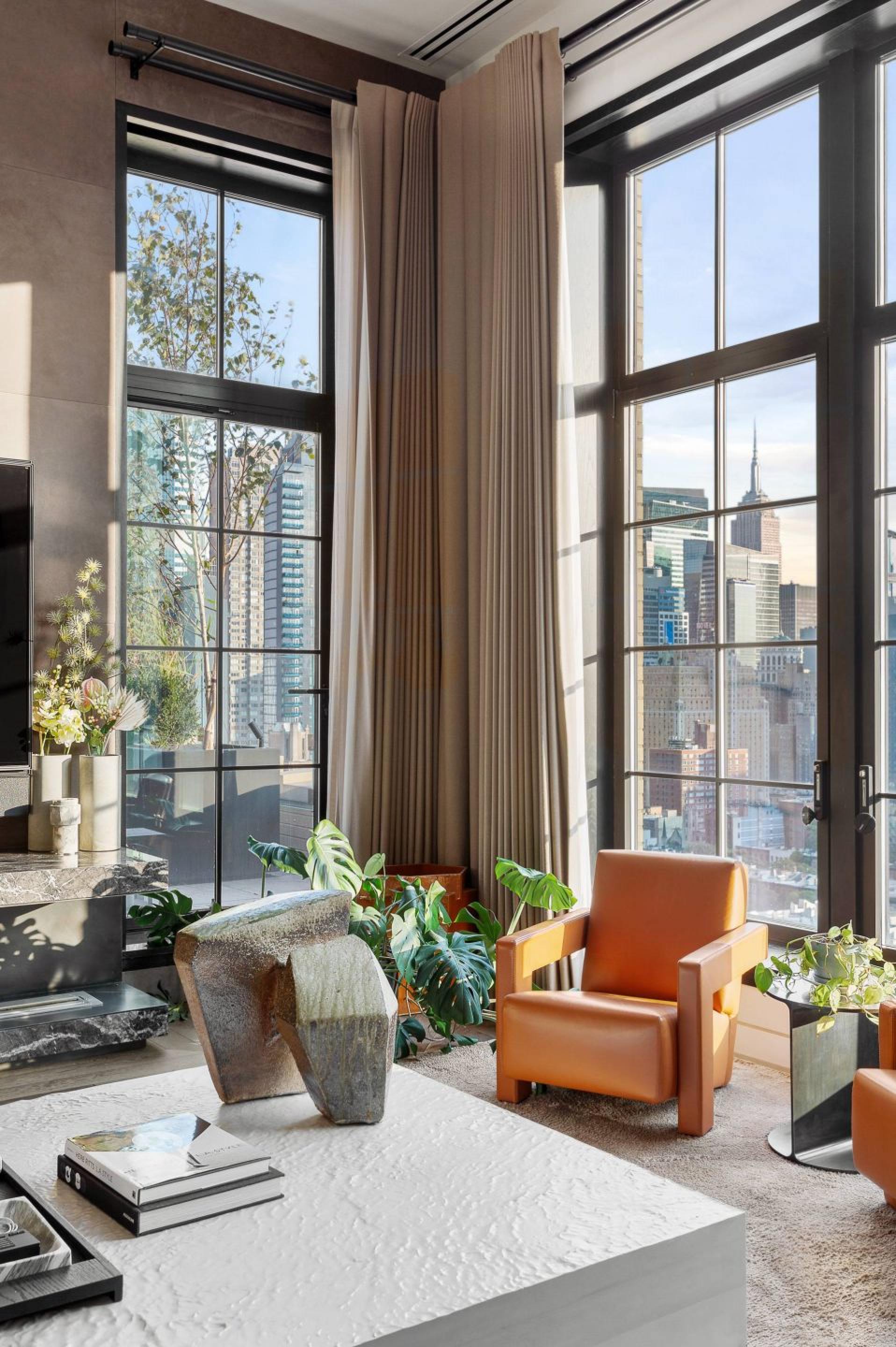 Trevor Noah’s Manhattan penthouse has tall ceilings that allow sunlight to flow through.