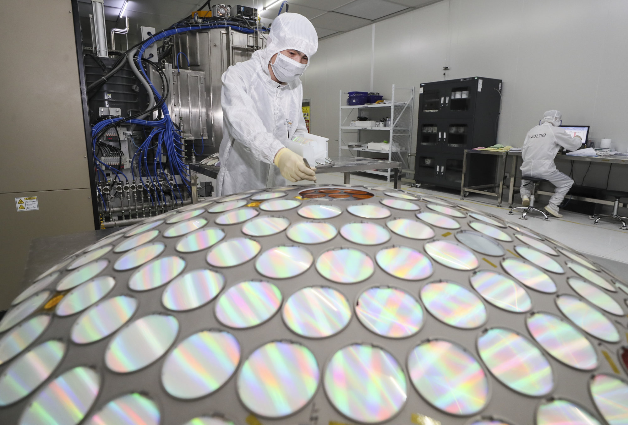 An employee works on the production line of Jiangsu Azure Corporation Cuoda Group on March 25, 2022, in Huai’an in Jiangsu province. Photo: VCG via Getty Images.