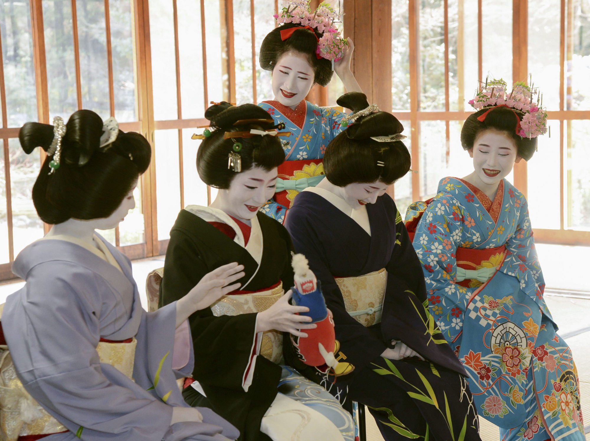 Geishas and maikos take part in a kimono-fitting session. File photo: Kyodo