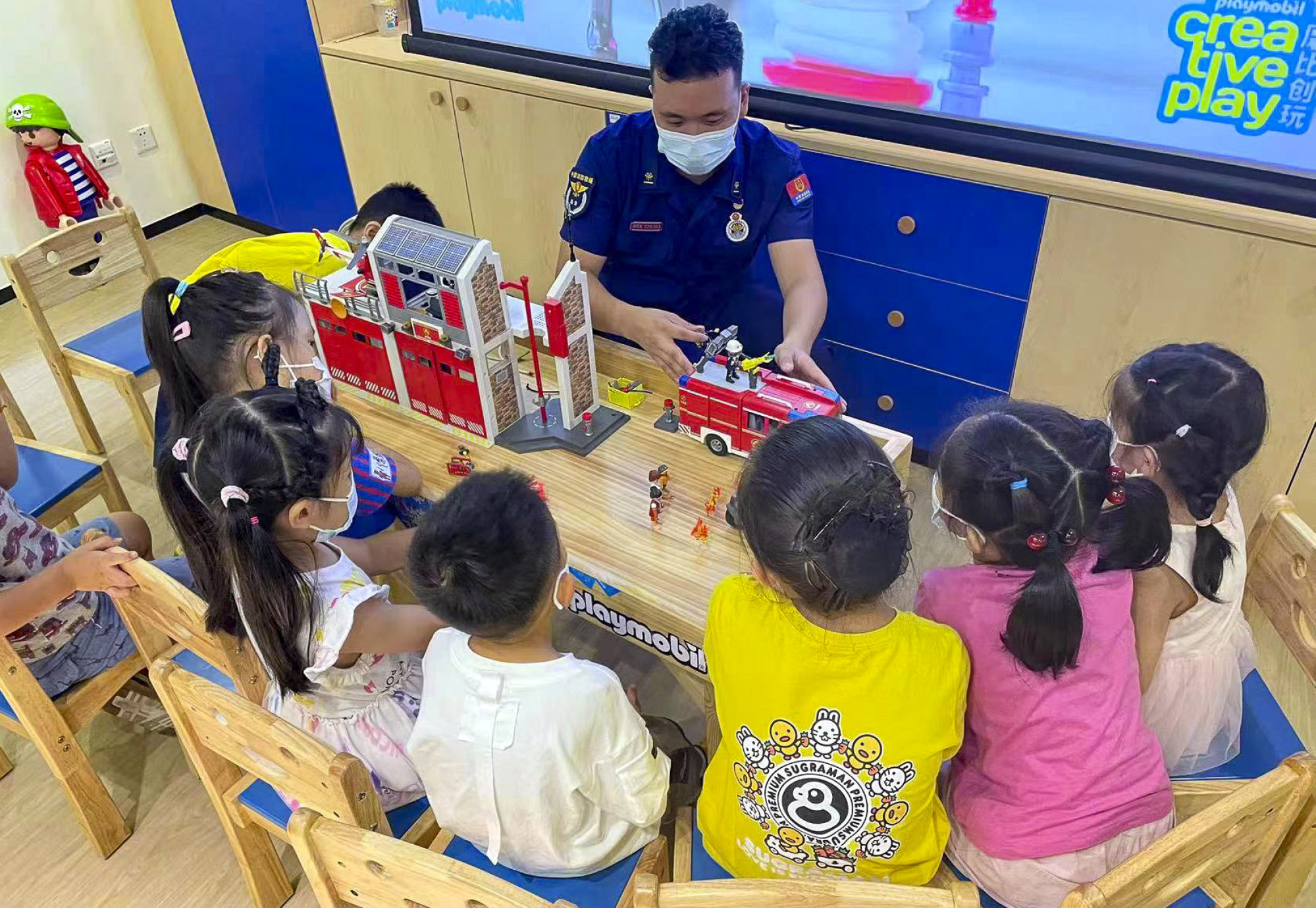 Children learn about Playmobil toys at a community event. Photo: Handout