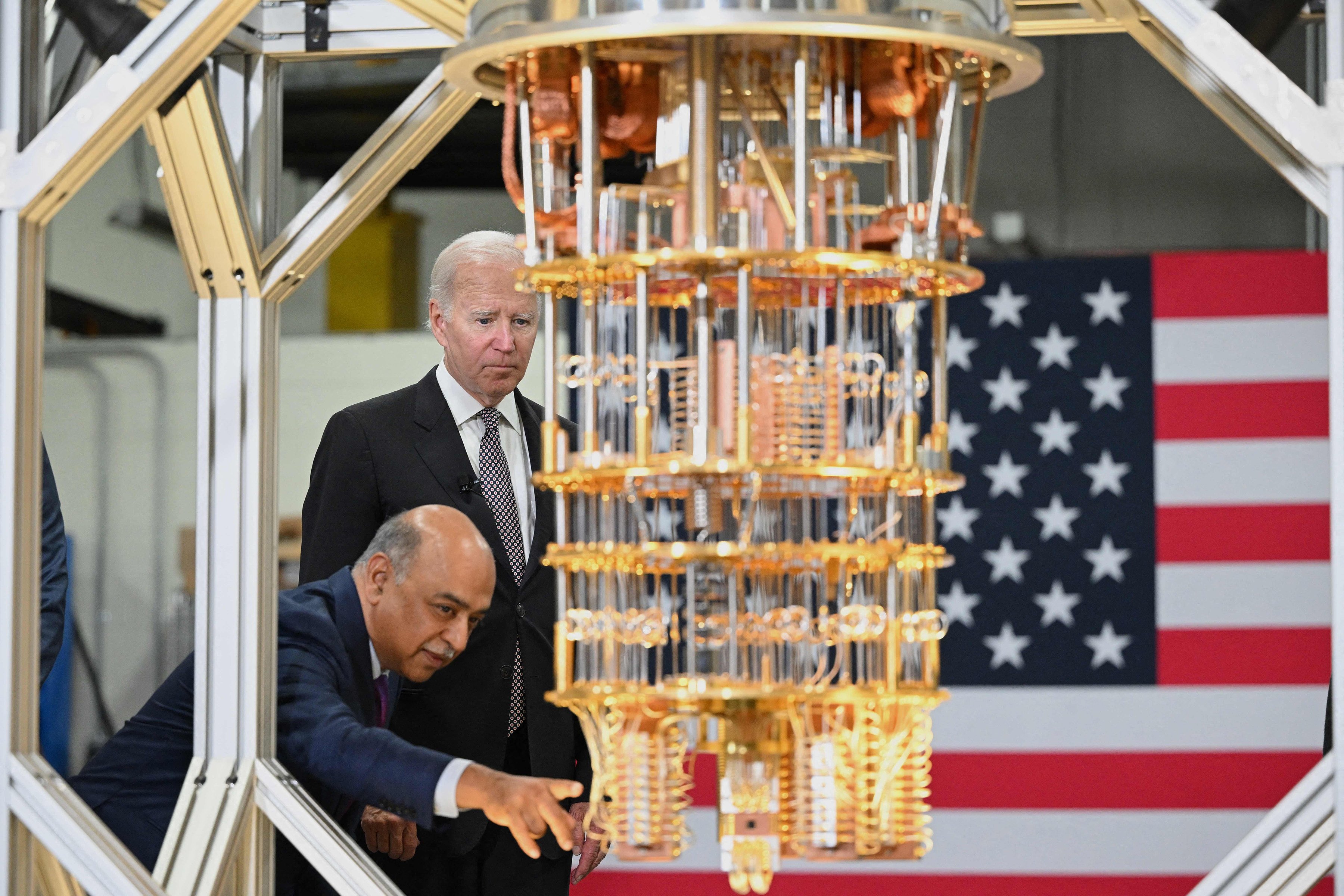 US President Joe Biden listens to IBM CEO Arvind Krishna during a tour of the IBM facility in Poughkeepsie, New York, on October 6. Krishna announced a US$20 billion investment in quantum computing, semiconductor manufacturing and other hi-tech areas in its New York state facilities. Photo: AFP