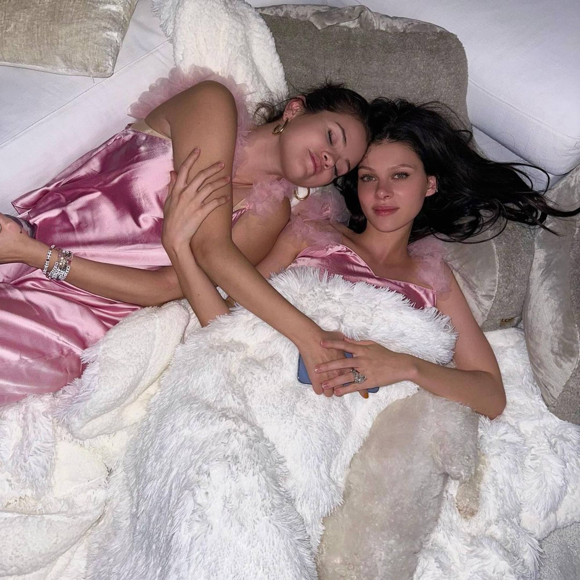 Selena Gomez cuddling up with Nicola Peltz. Photo: @nicolaannepeltzbeckham/Instagram