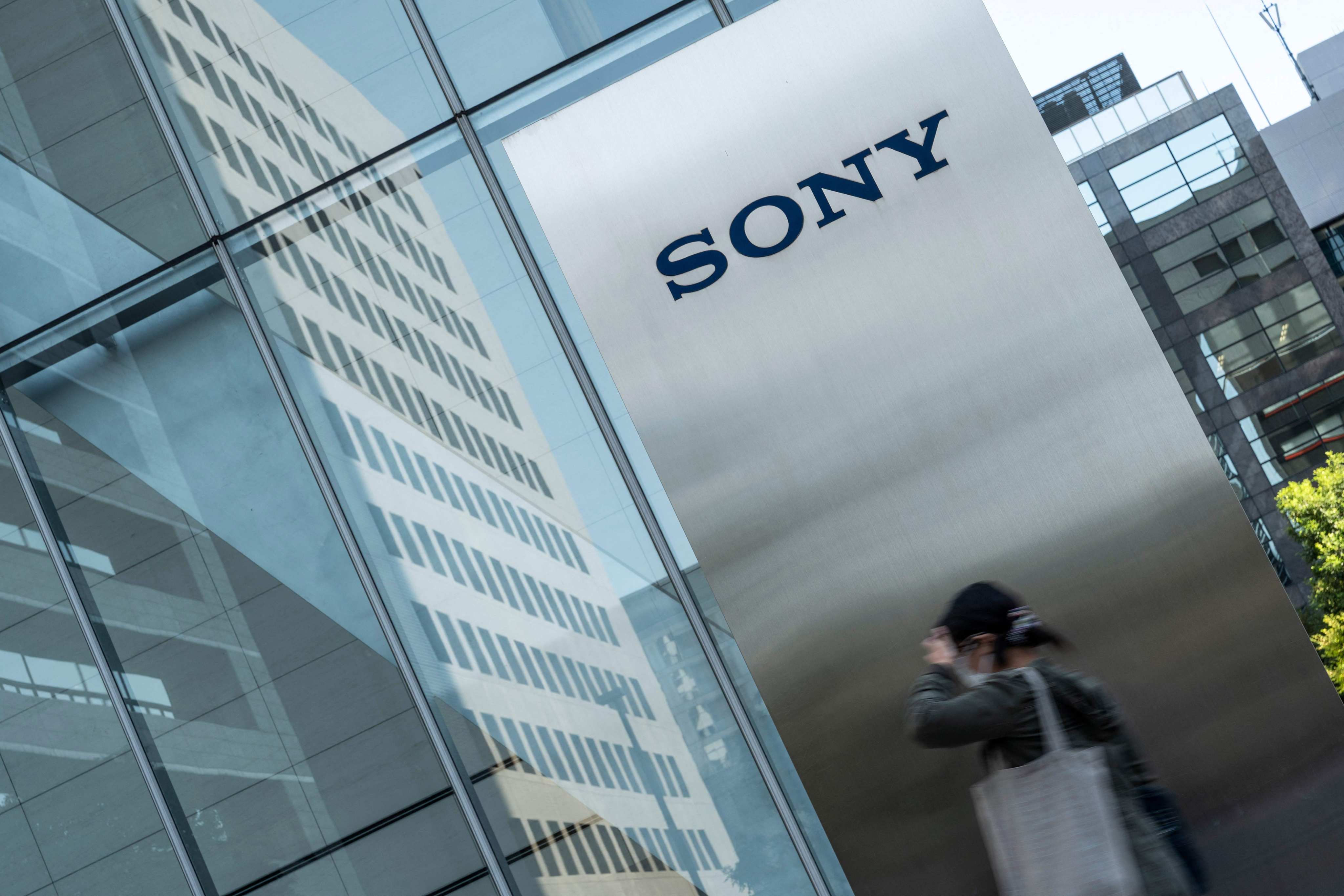 A woman is seen walking outside Sony Group's headquarters in Tokyo on  October 31, 2022. Photo: Agence France-Presse