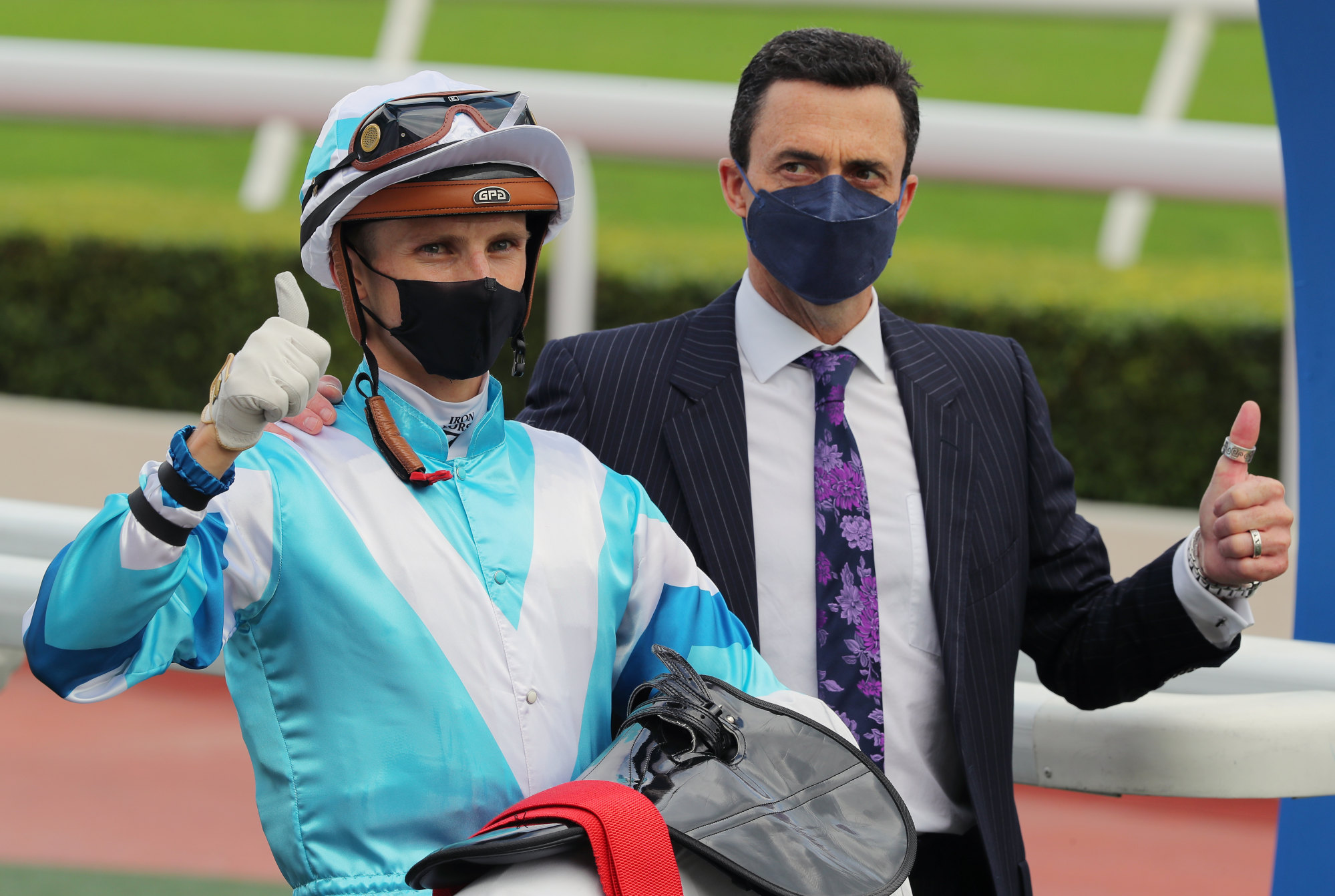 Jockey Lyle Hewitson and trainer Douglas Whyte celebrate Dragon’s Luck’s win.