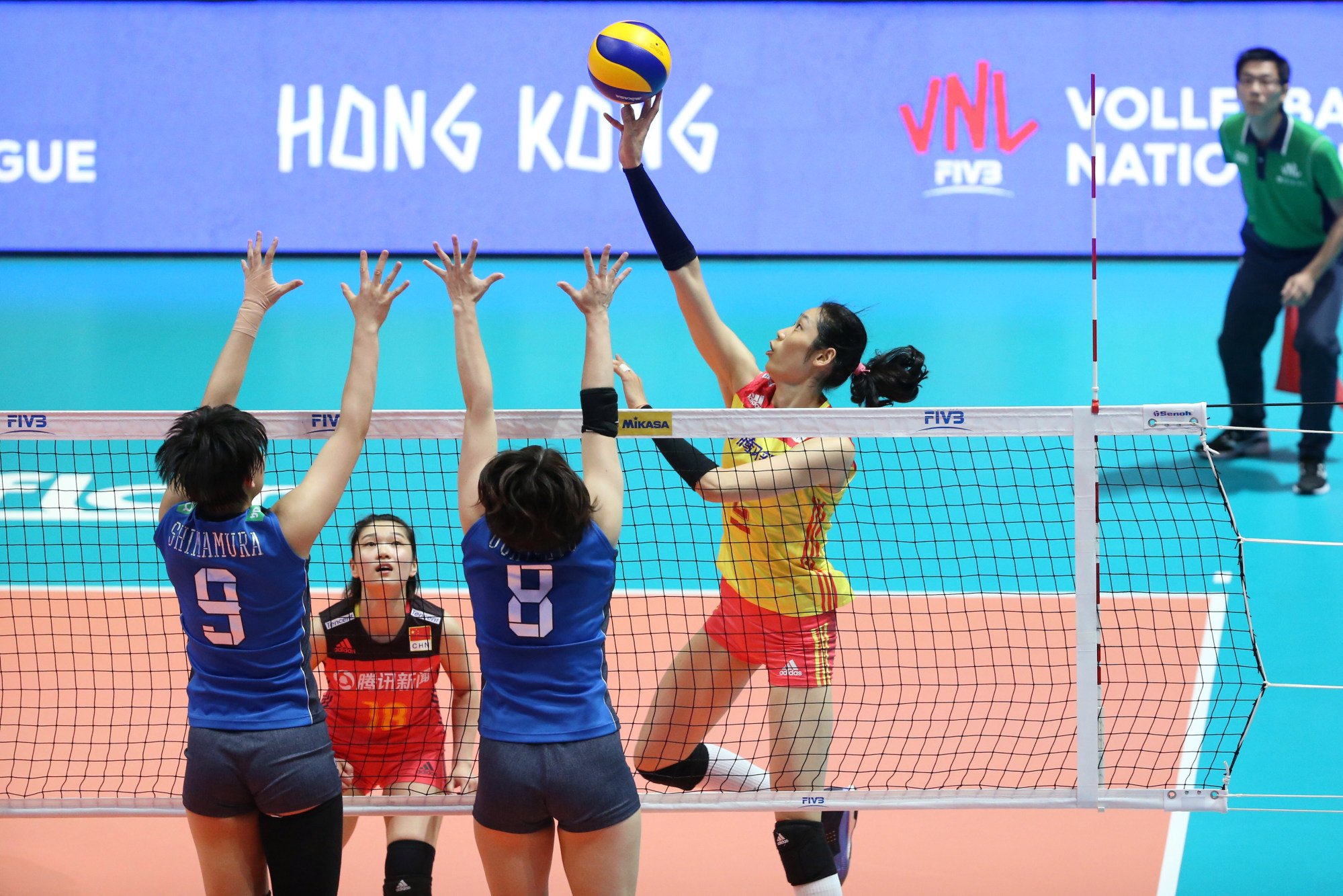Zhu Ting tries to score against Japanese players Haruyo Shimamura and Mami Uchiseto at the 2018 FIVB Volleyball Nations League in Hong Kong’s Coliseum in Hung Hom. Photo: Felix Wong