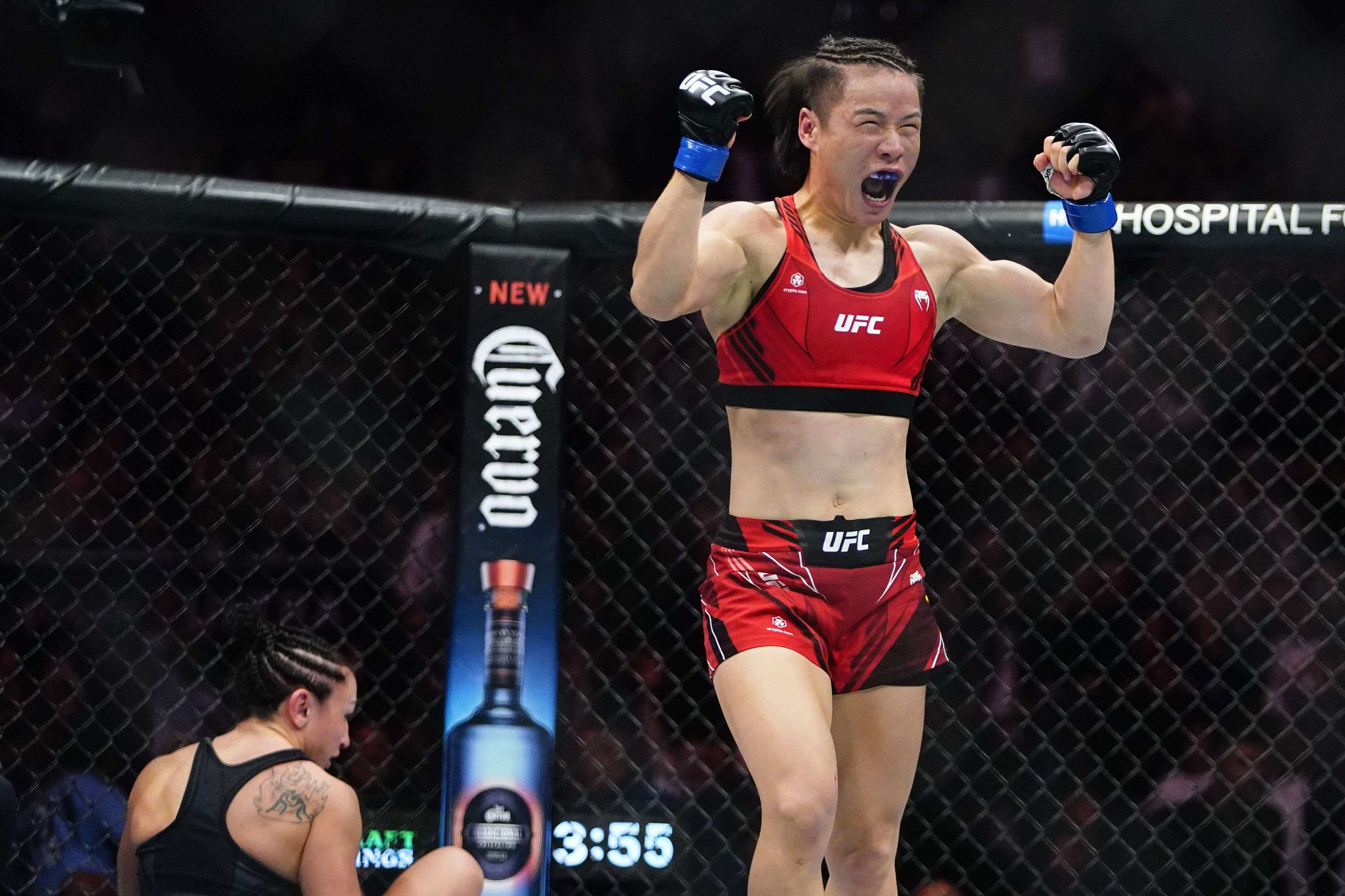 China’s Zhang Weili celebrates after defeating Carla Esparza in a women’s strawweight title bout at UFC 281 in New York. Photo: AP