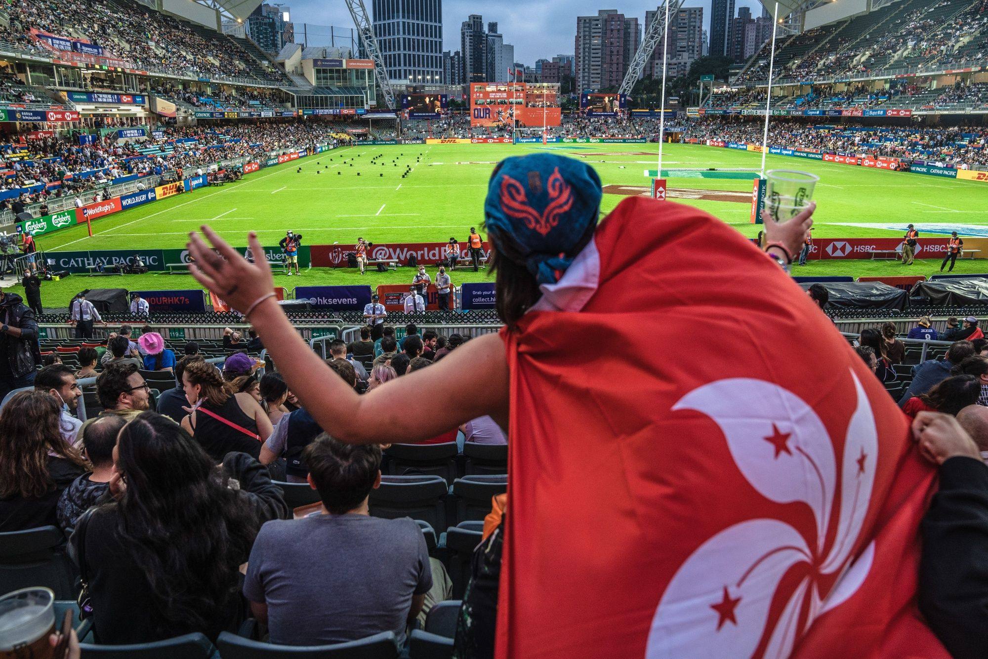 A spectator wears a Hong Kong flag in the Hong Kong Stadium on November 4, at the first rugby Sevens tournament in Hong Kong since the pandemic began. Photo: Bloomberg 
