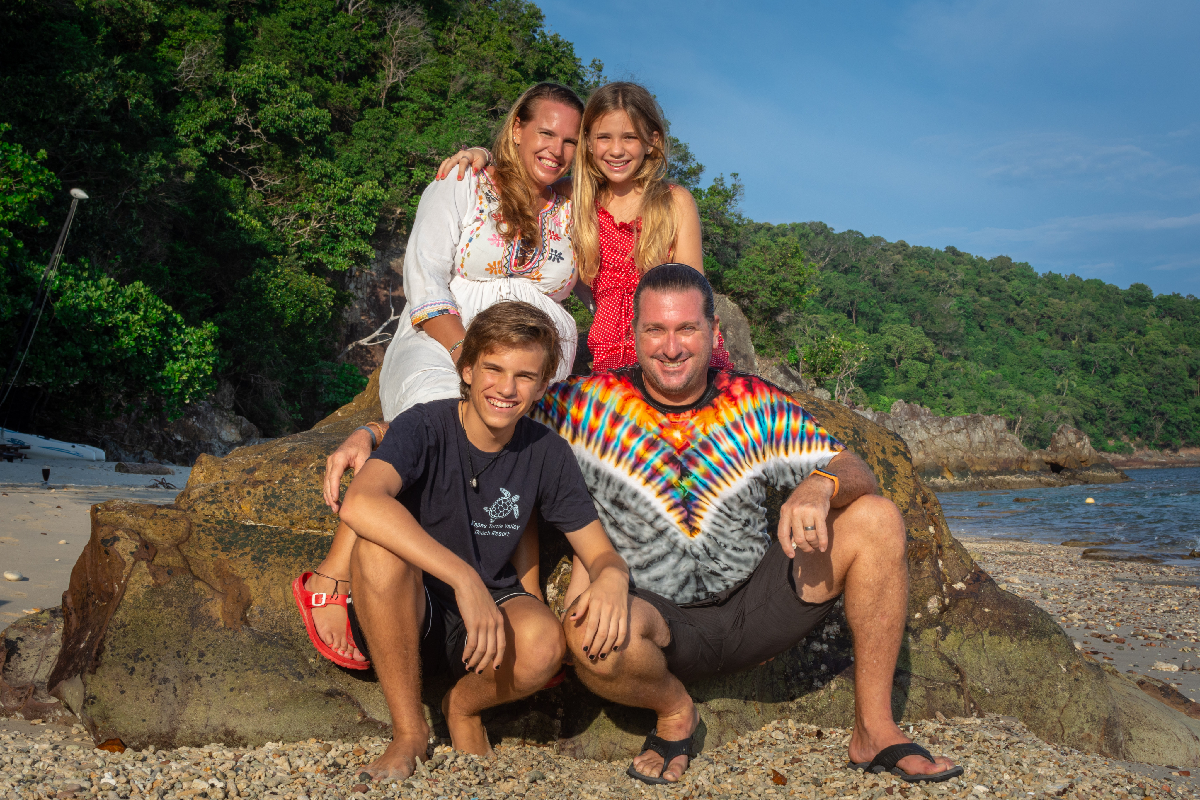 Nadia Louw (back left) and Nicholas Smith (front right) and their children Liam and Mila on Kapas Island, Malaysia. In 2019, Louw bought a tiny resort on the island. Photo: Christophe Wauters