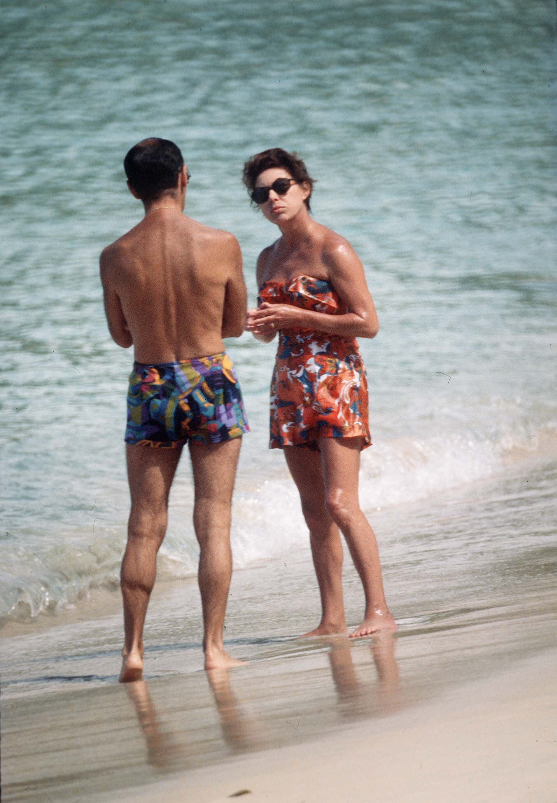 Princess Margaret chats to a friend on the beach while on holiday in 1976, in Mustique, West Indies. Photo: Getty Images