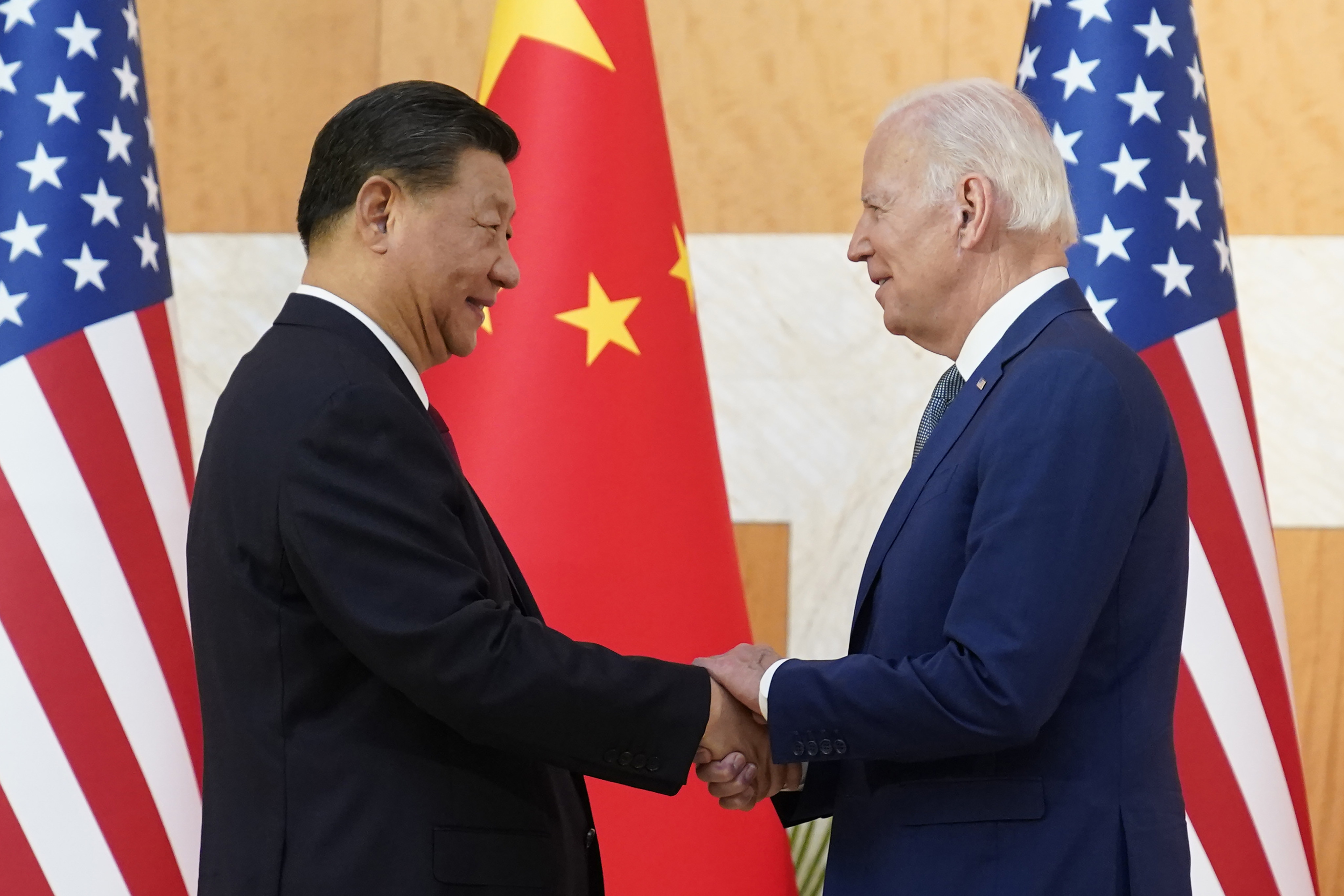 Chinese President Xi Jinping and US President Joe Biden shake hands before their meeting on the sidelines of the G20 summit in Bali, on Monday. Photo: AP Photo