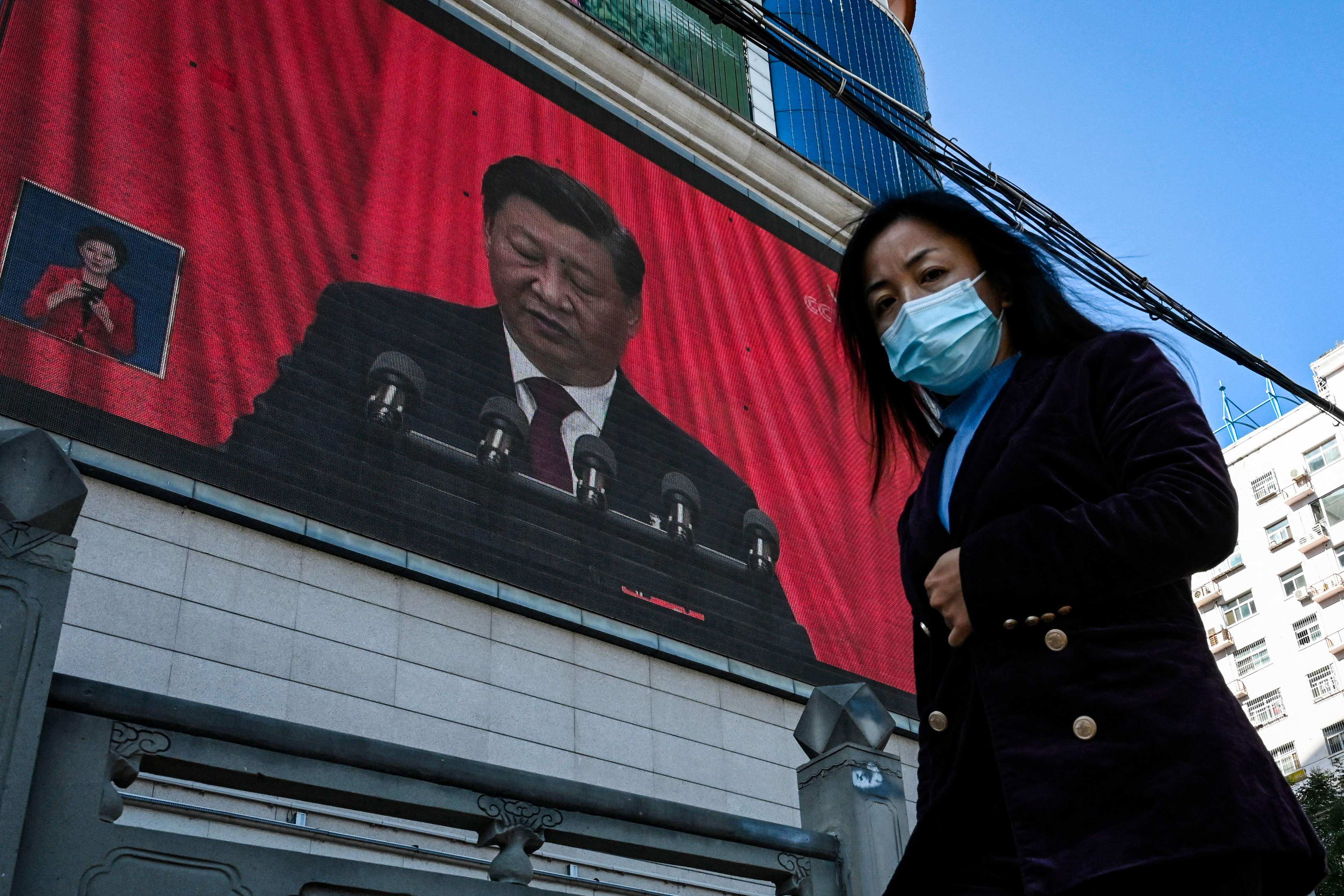 Xi Jinping is seen on a screen in Yan’an city, China, as he speaks at the 20th Chinese Communist Party Congress on October 16. Photo: AFP