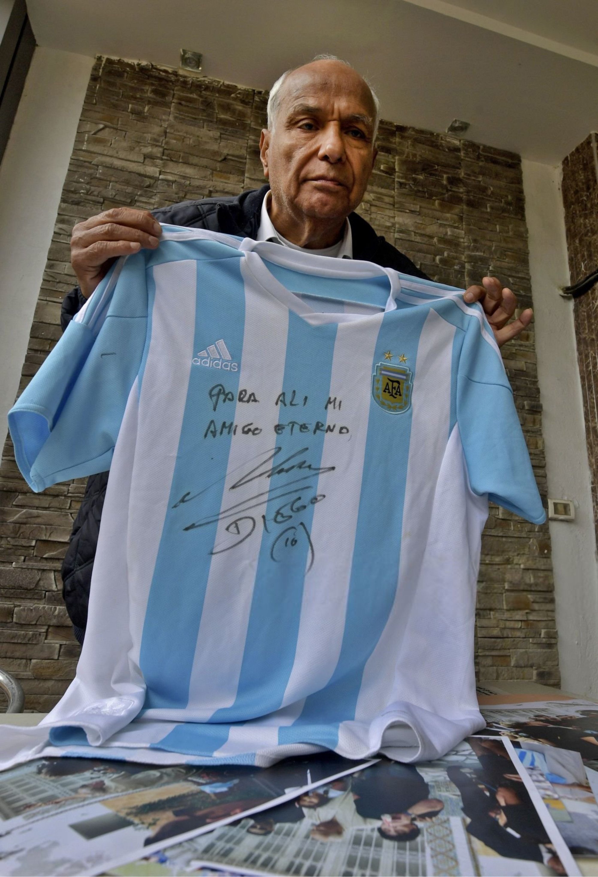 FILE - The Argentina football shirt worn by Diego Maradona in the 1986  Mexico World Cup quarterfinal soccer match between Argentina and England,  is displayed for photographs at Sotheby's auction house, in