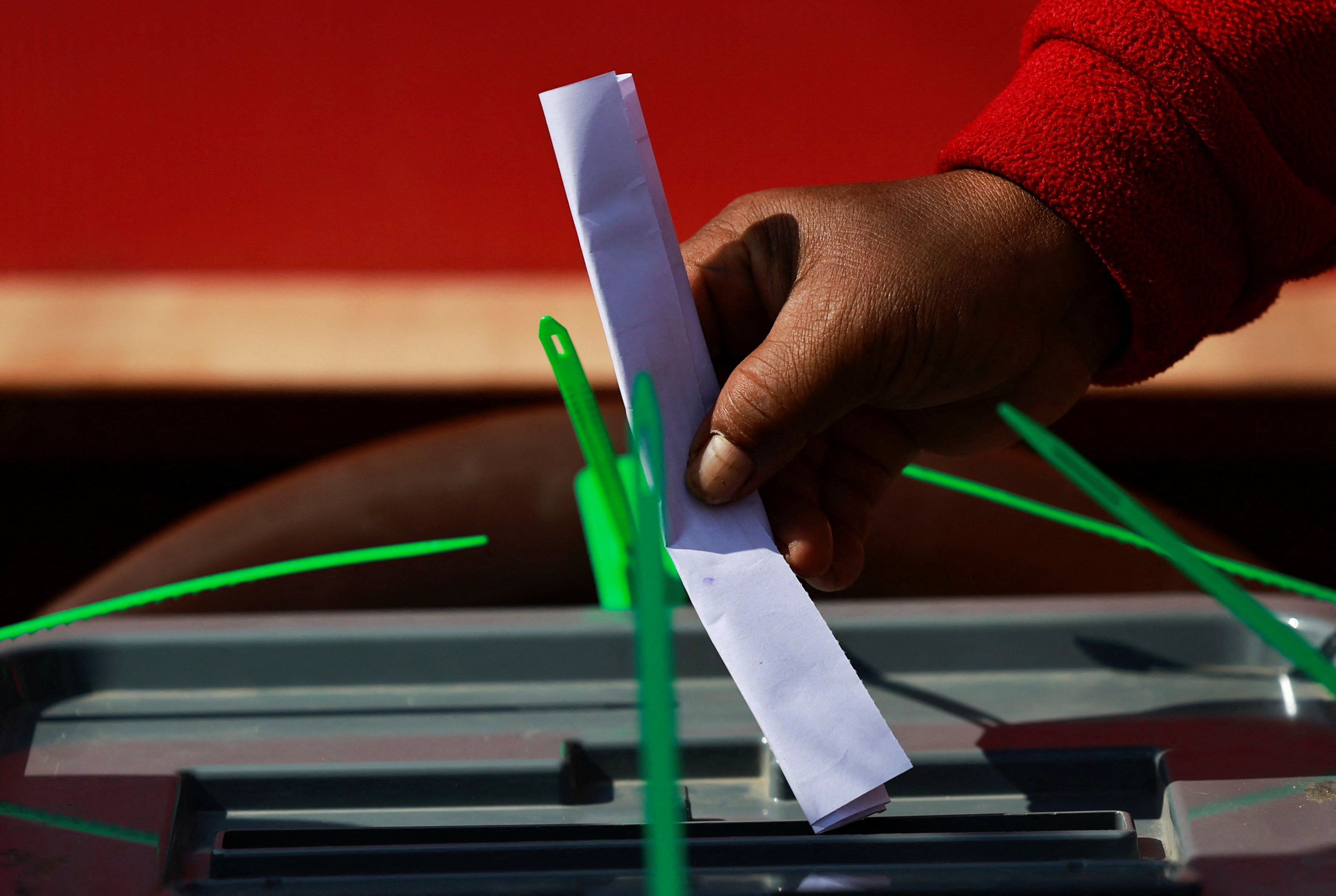 A woman casts her vote into a ballot box during a mock election in Nepal, held earlier this month to familiarise people with the electoral process. Photo: Reuters