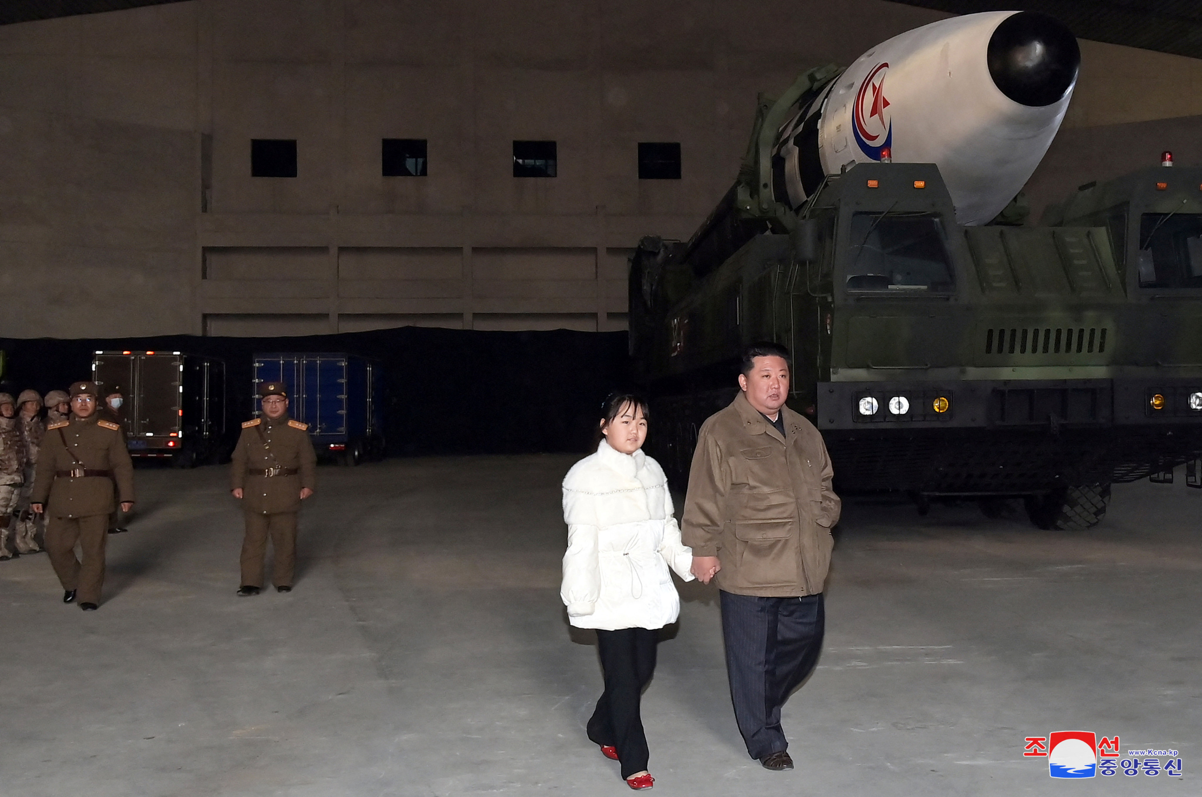 North Korean leader Kim Jong-un, with his daughter, inspects an intercontinental ballistic missile (ICBM) in this photo released on Saturday. Photo:  KCNA via Reuters