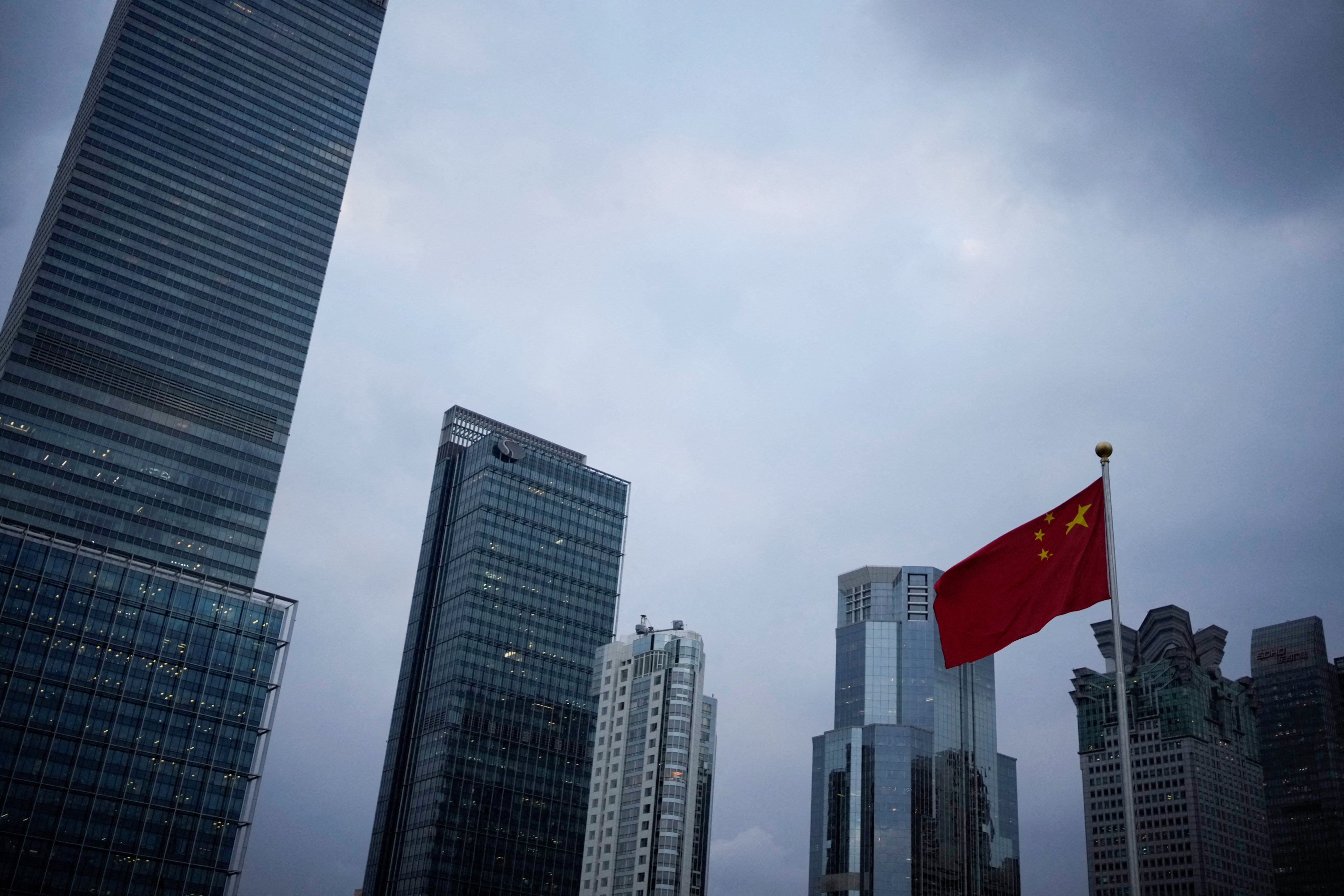 China’s national flag is pictured in Shanghai on October 14. China’s policies since the Covid-19 outbreak have led to vast capital outflows and an accelerated sell-off of Chinese stocks. Photo: Reuters 