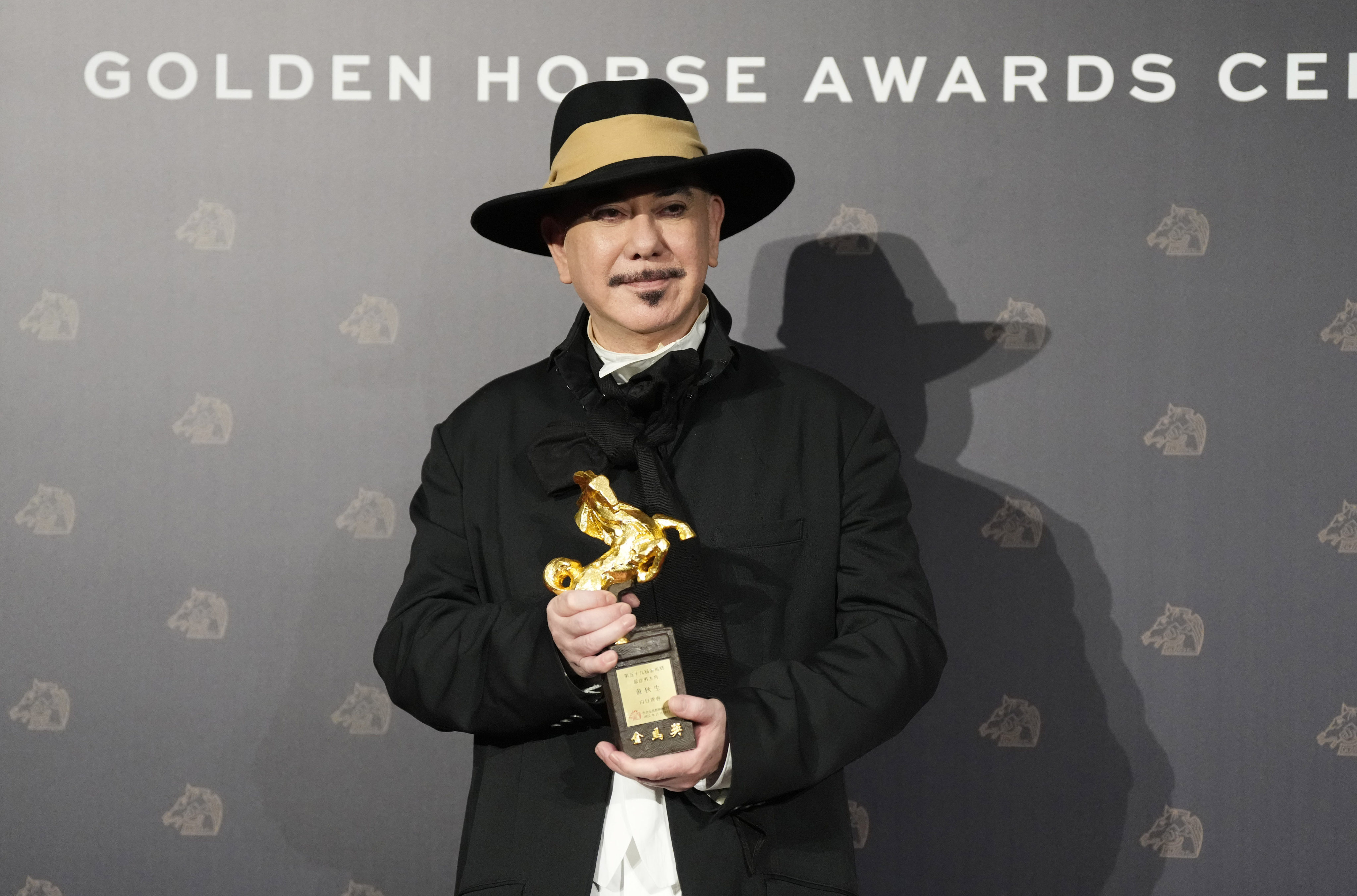 Hong Kong actor Anthony Wong holds his award for best actor at the Golden Horse Awards in Taipei, Taiwan on Saturday. Photo: AP