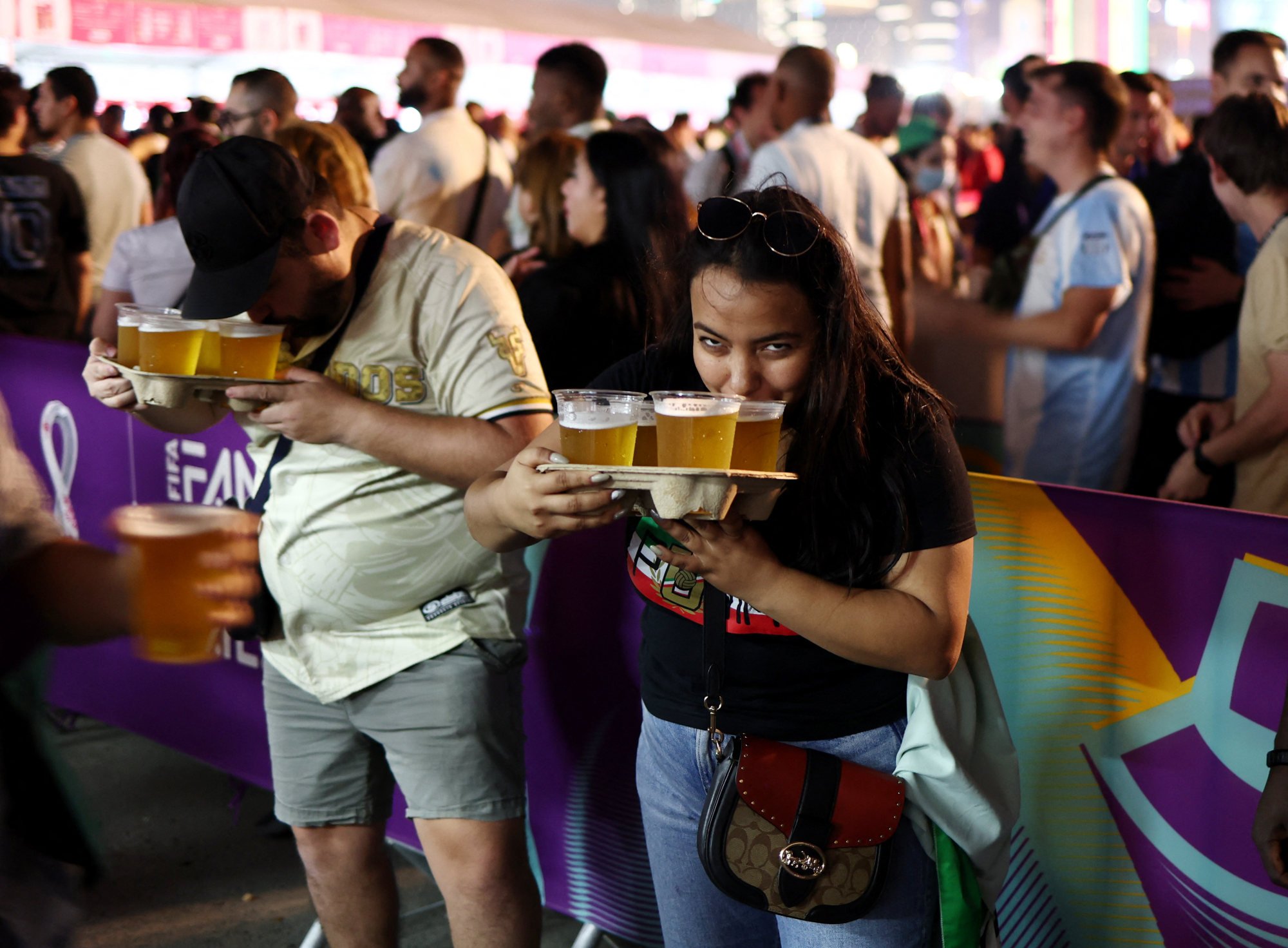 Fans drink beer during the opening of the Fifa fan festival. Photo: Reuters