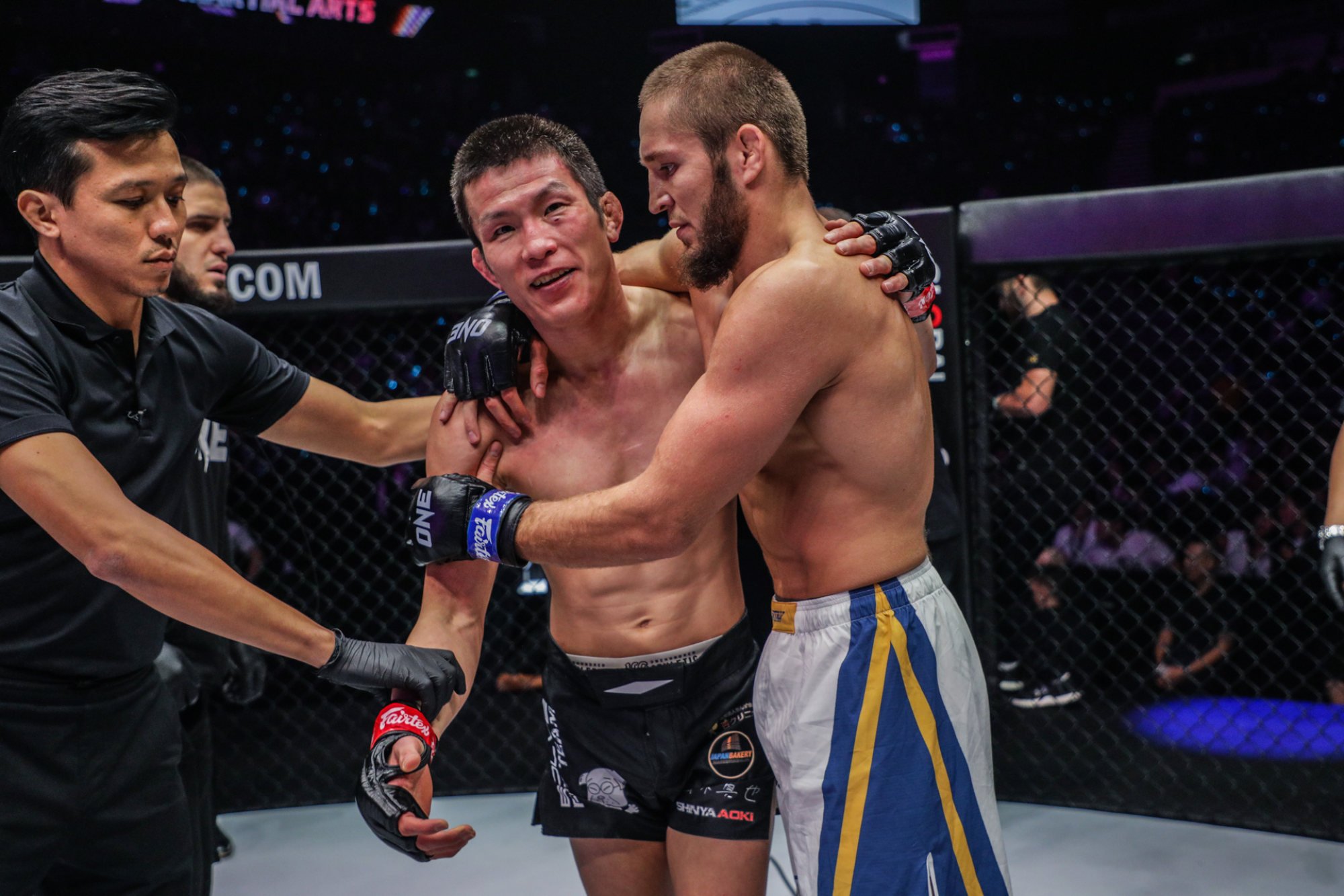 Saygid Izagakhmaev hugs Shinya Aoki after beating him at ONE 163 in Singapore.