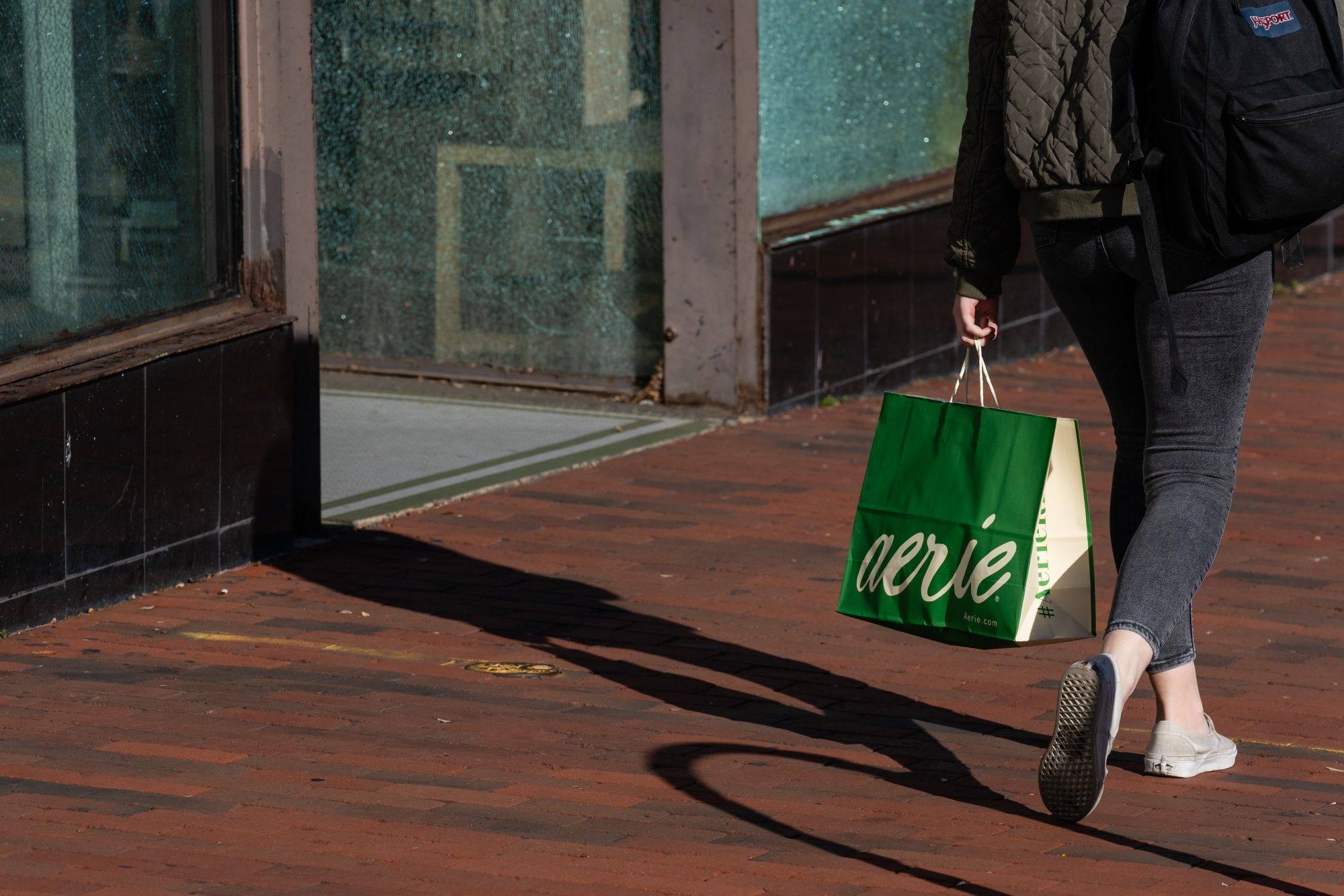 A pedestrian carries a shopping bag in the Georgetown neighbourhood of Washington on November 9. Consumer confidence has already been deeply shaken by the pandemic and the war in Ukraine, but the cost-of-living squeeze is leaving a deeper wound. Photo: Bloomberg