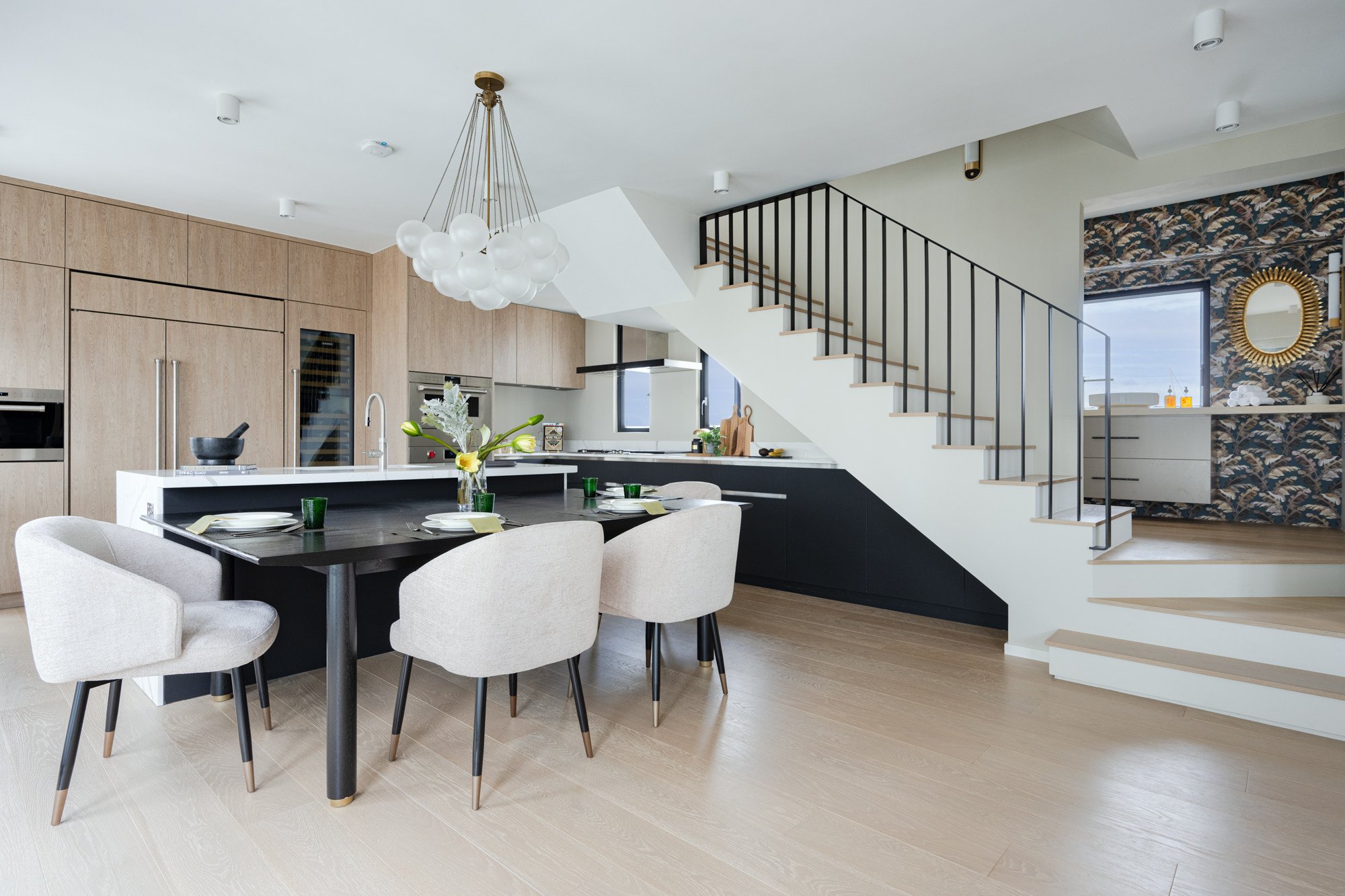 The dining area on the lower floor of the Damienne Joly-designed flat in Mid-Levels, including the vanity section of a bathroom (behind the staircase) that Joly opened up to reveal a “priceless vista”. Photo: Eugene Chan