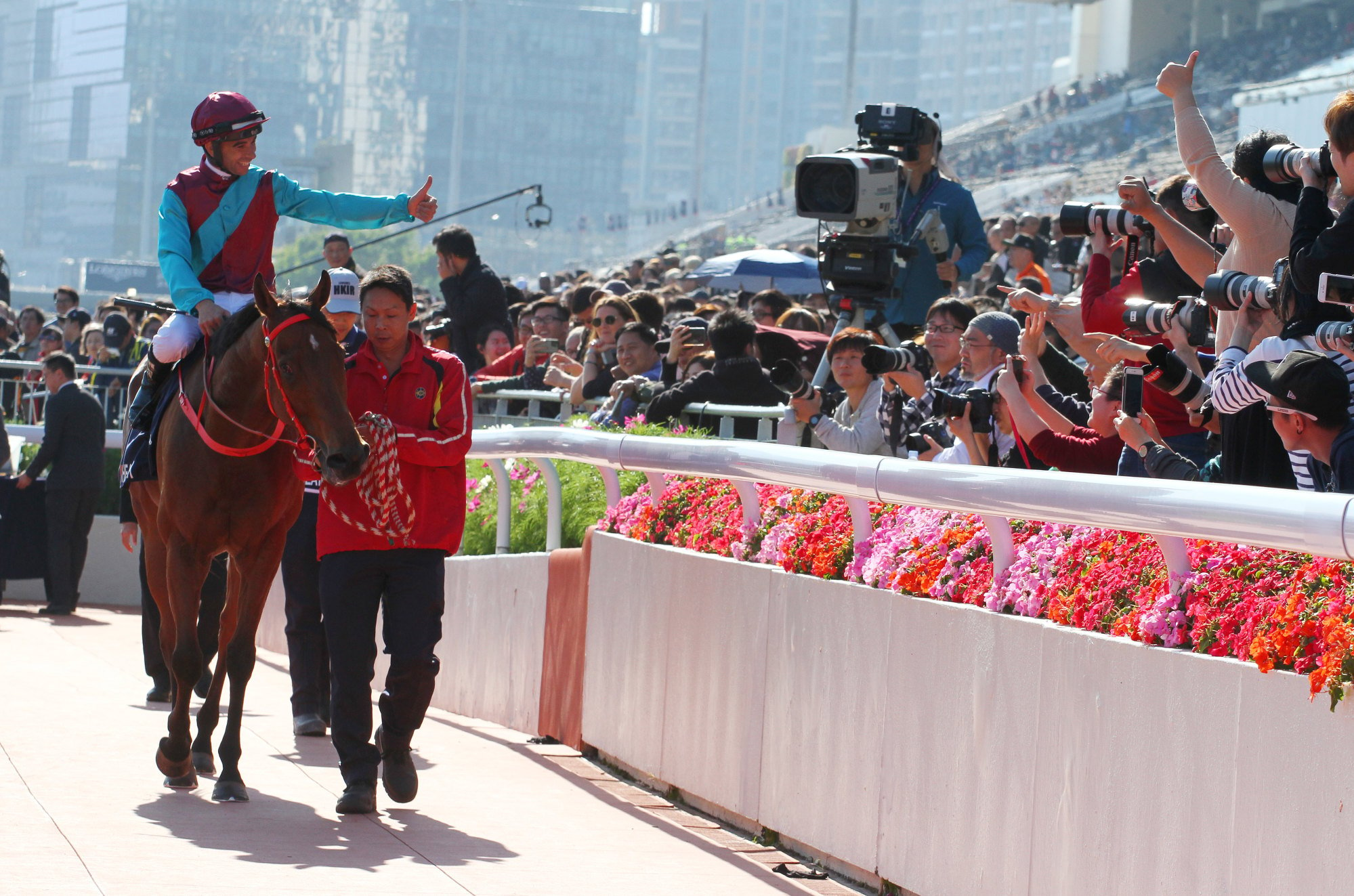 Joao Moreira engages with the crowd after winning the Hong Kong Sprint atop Beat The Clock in 2019.