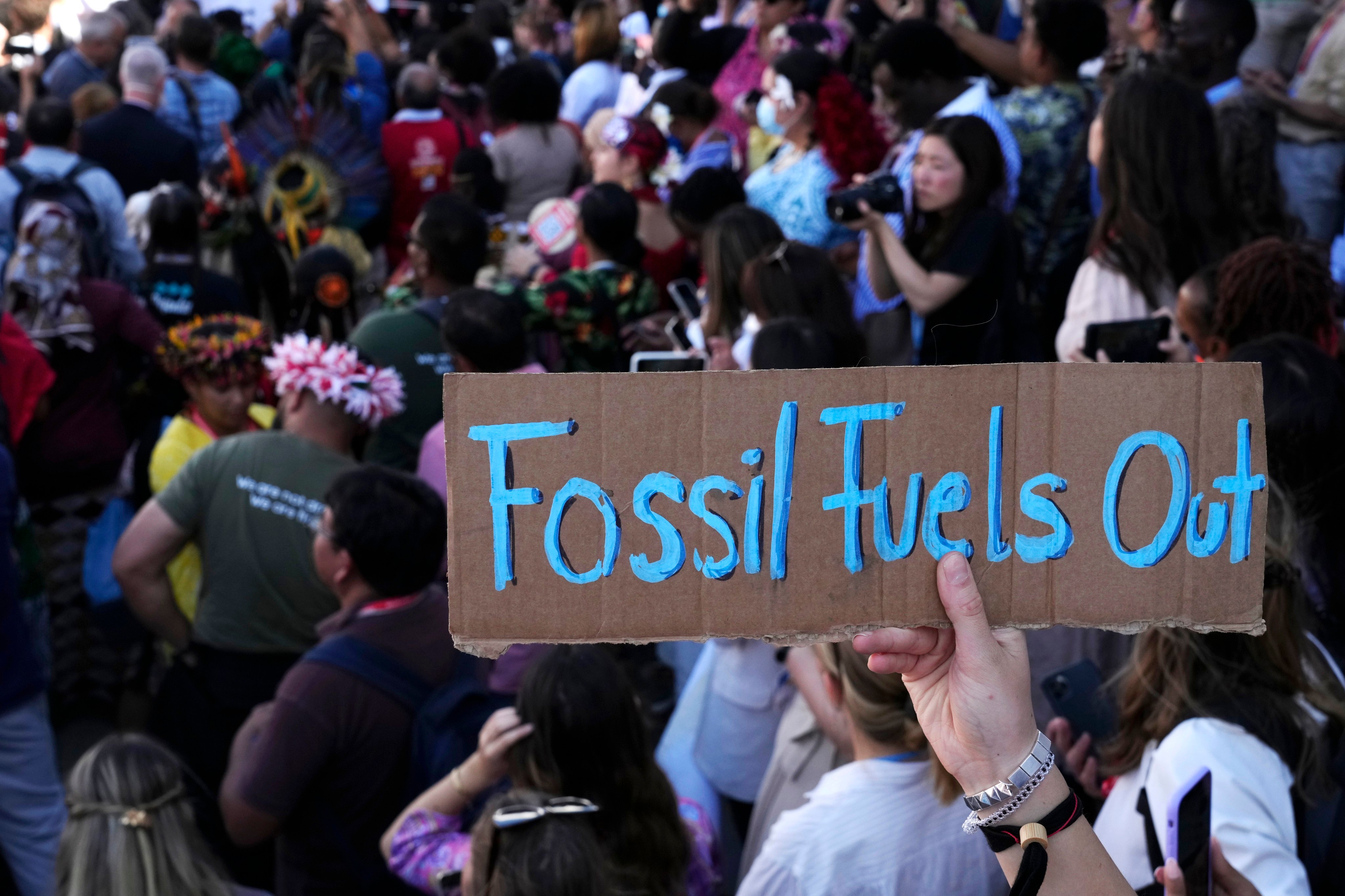 A sign reading “fossil fuels out” is displayed during a demonstration at COP27 on November 12 in Sharm el-Sheikh, Egypt. Simon Stiell, UN climate chief, acknowledges nations didn’t do anything additional to address climate change itself at the meeting. Photo: AP
