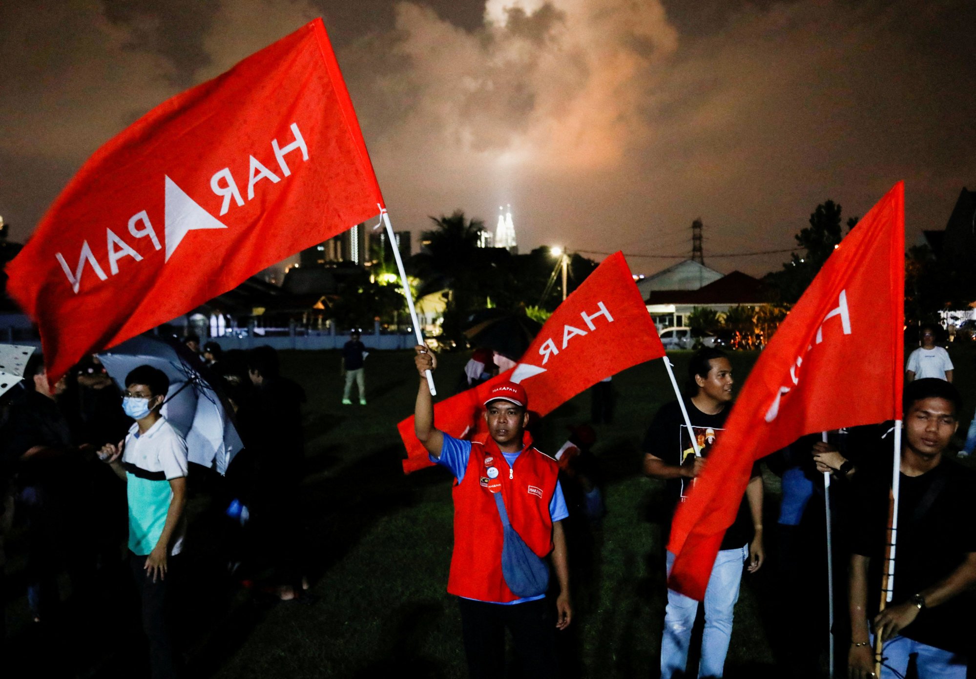 Pakatan Harapan’s symbol is its name embossed on a background of crimson red, the same shade as the attire worn by the Taiwanese rally goers in the video shared by Annuar. Photo: Reuters