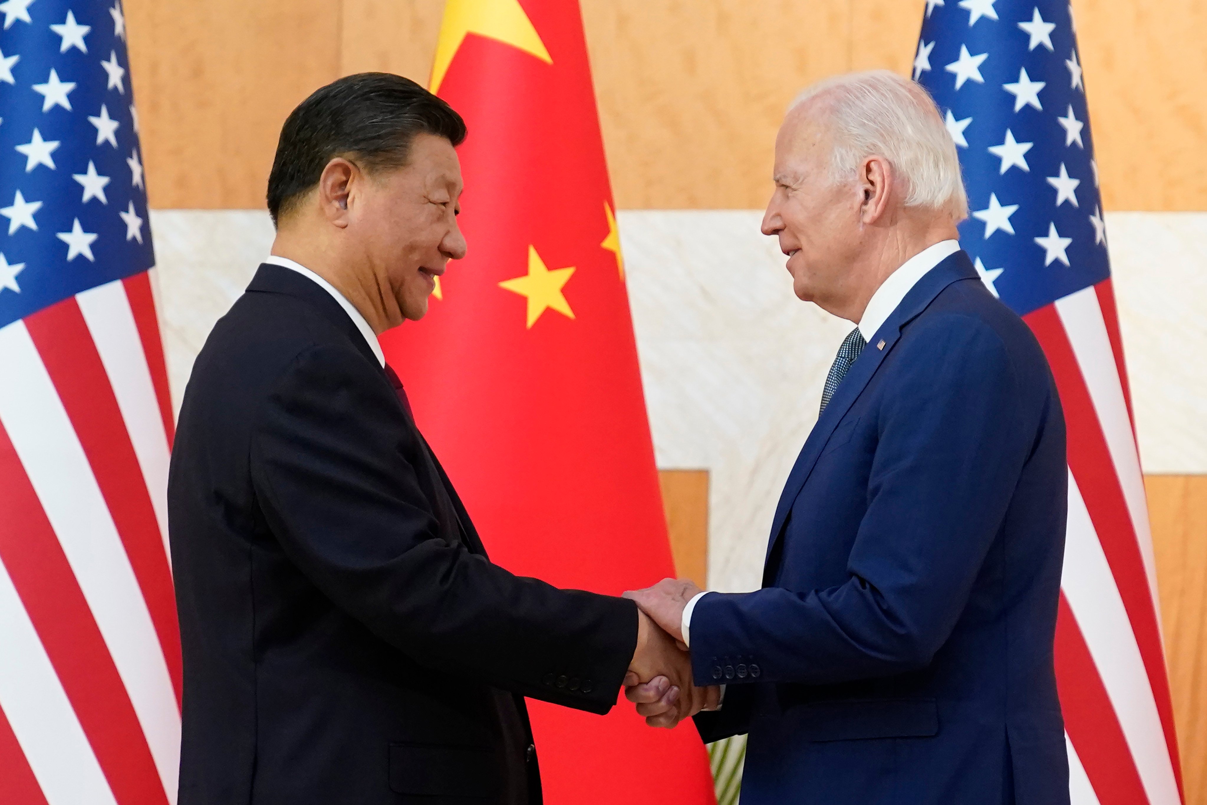 Chinese President Xi Jinping and US President Joe Biden shake hands before their meeting on the sidelines of the G20 summit on November 14 in Bali, Indonesia. Photo: AP
