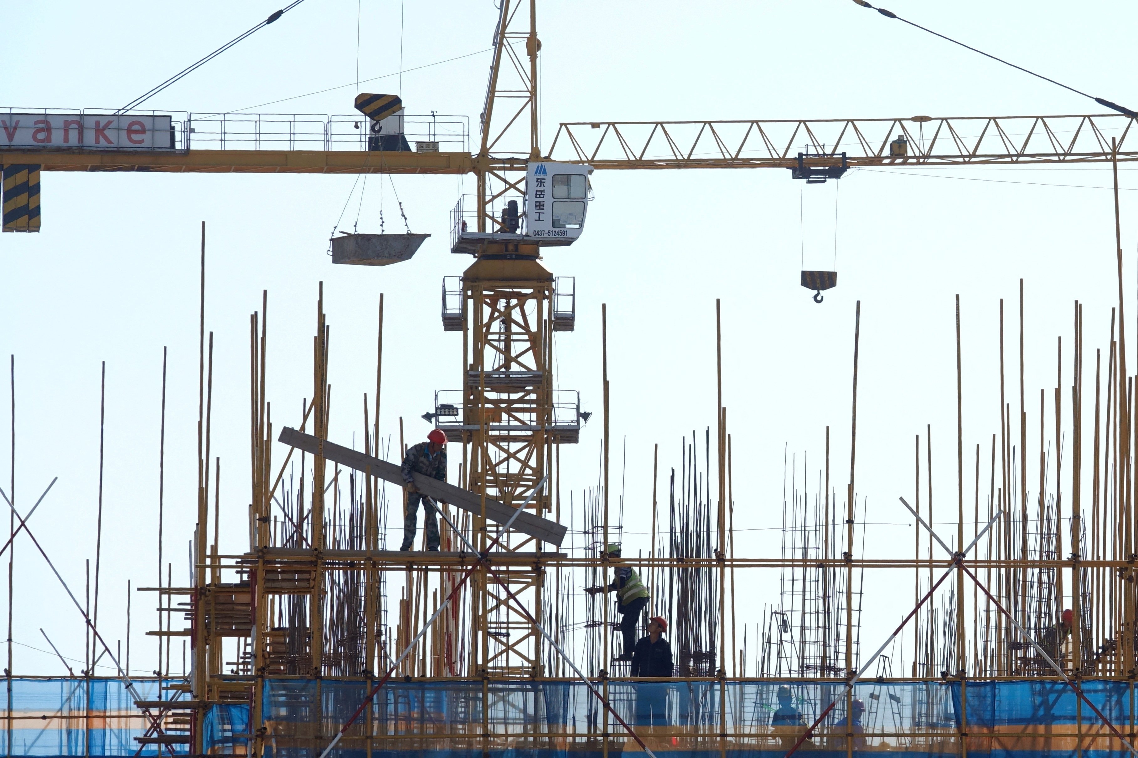 A Vanke sign is at a residential construction site in Dalian, Liaoning province. Chinese banks have offered credit support for struggling developers such as Vanke to revive the stricken property sector. Photo: Reuters