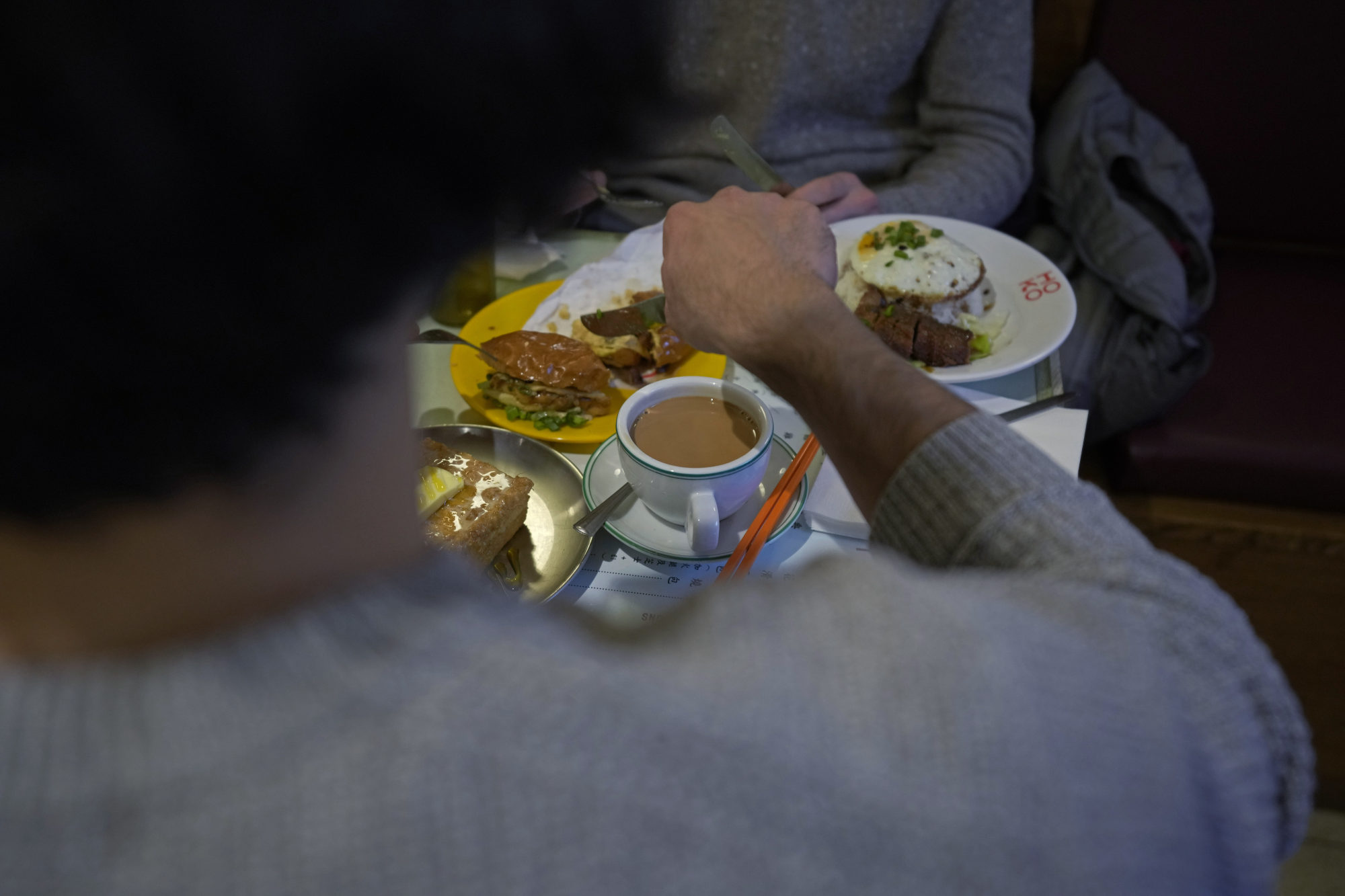 Patrons enjoy Hong Kong-style milk tea in Shoreditch, London. Photo: AP/Kin Cheung