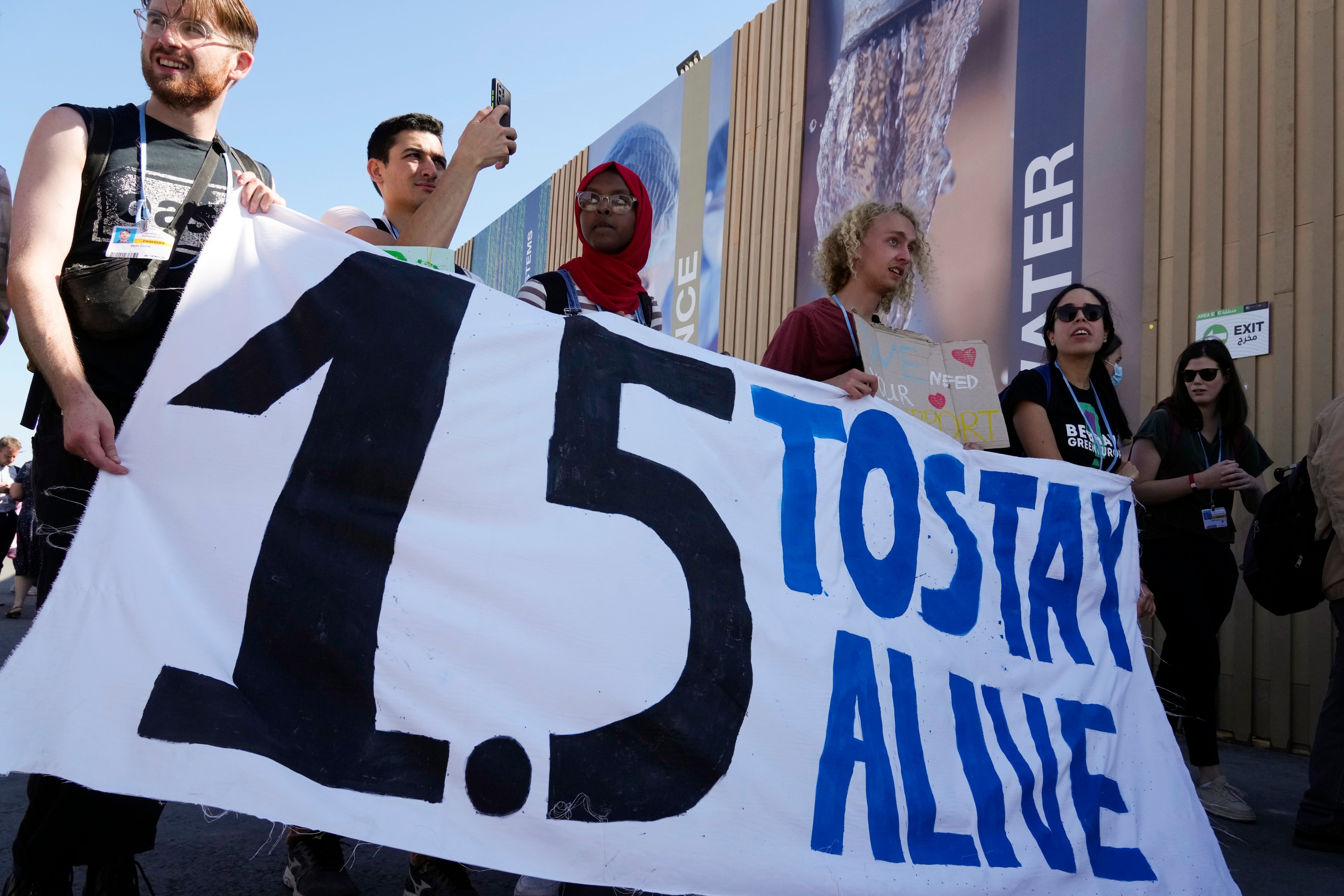 Demonstrators hold a sign during a protest that reads “1.5 to stay alive” at the COP27 UN climate summit on November 12 in Sharm el-Sheikh, Egypt. Photo: AP