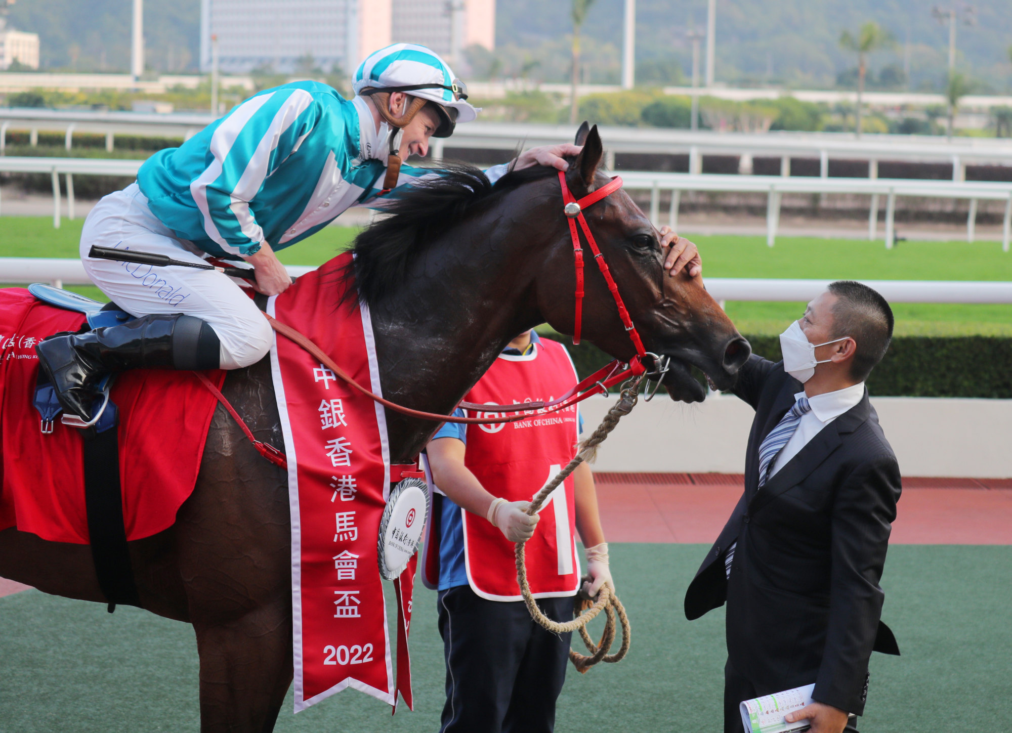 Danny Shum pats Romantic Warrior after his Group Two Jockey Club Cup (2,000m) win under James McDonald.
