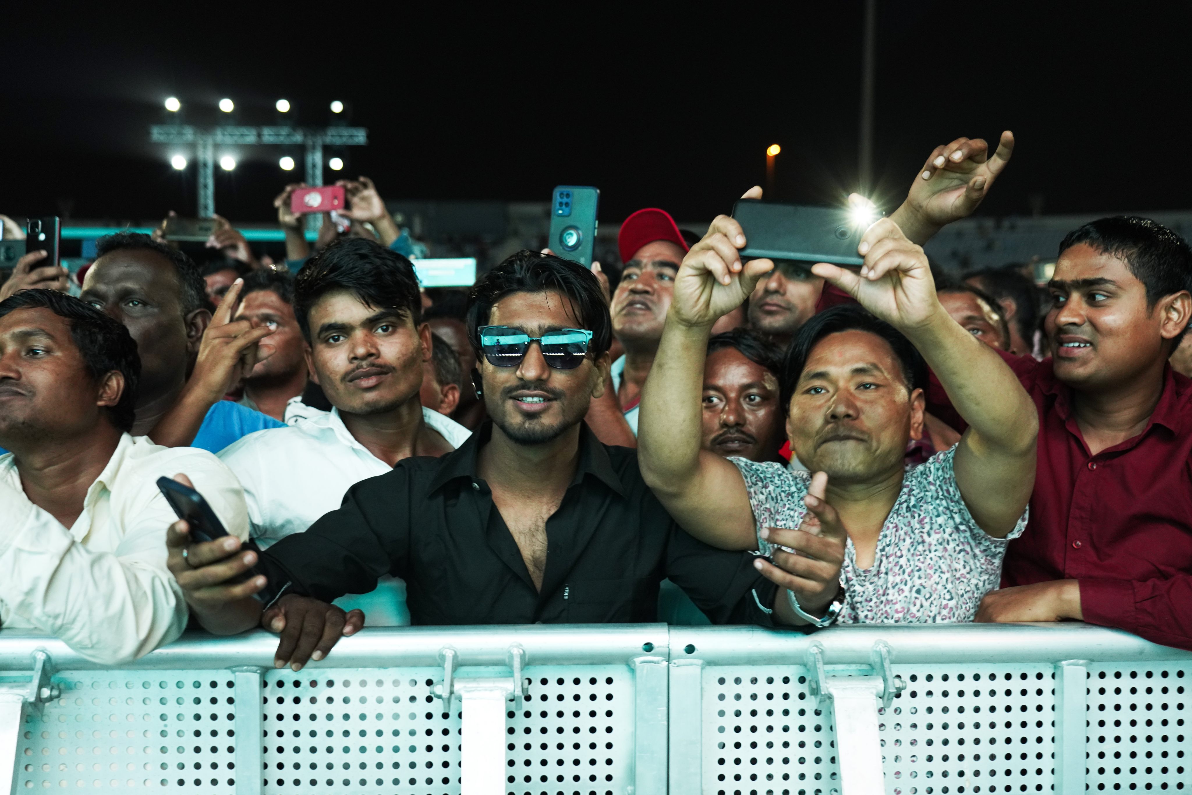 Labourers cheer at a fan festival at the Asian Town cricket stadium in Doha, Qatar. Photo: AP