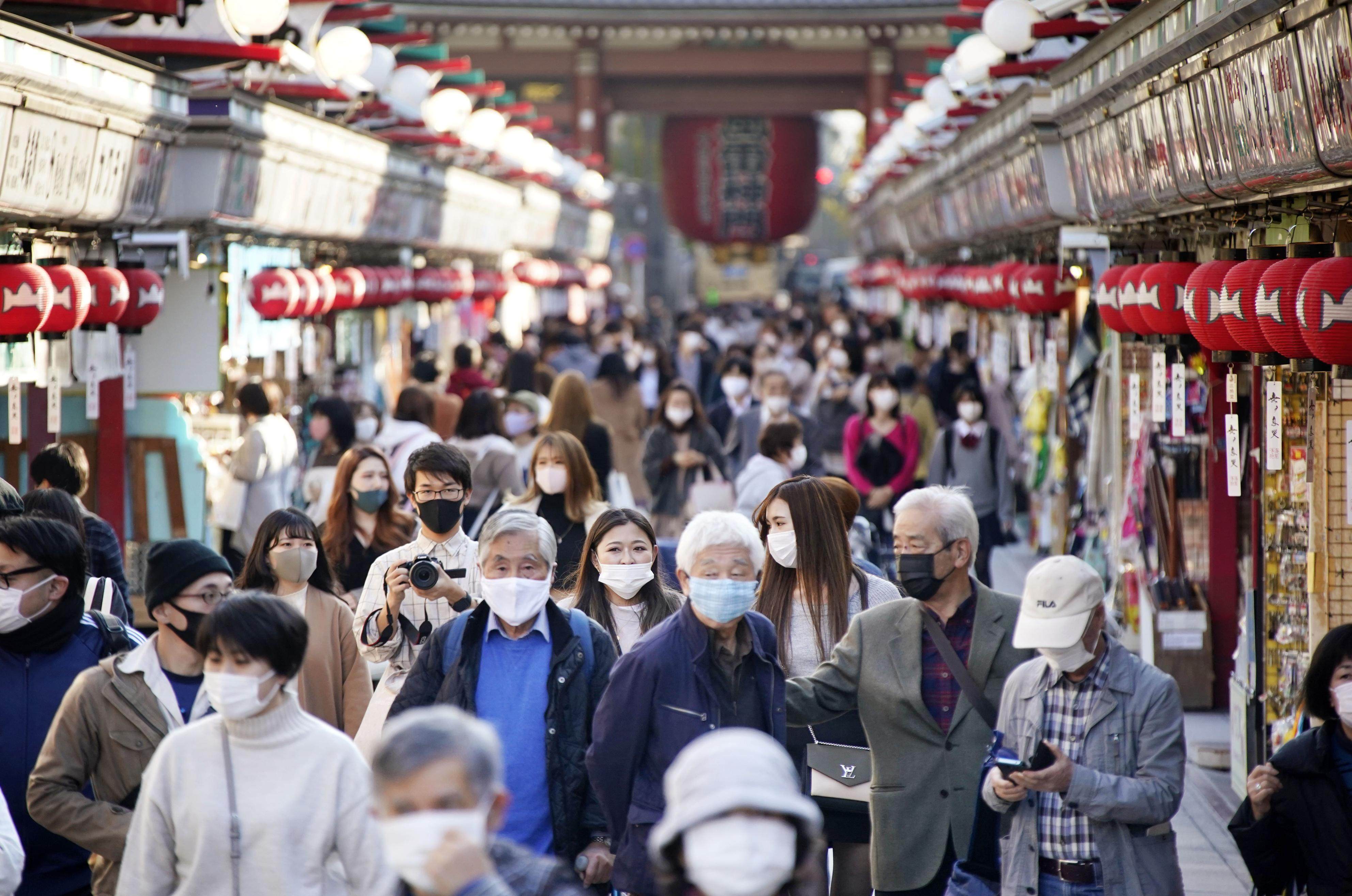 Elderly people walk with others through the Asakusa area of Tokyo. South Korea’s central bank chief thinks Japan’s ‘sideshow’ of using stimulus to combat the challenges of an ageing economy is best avoided. Photo: Kyodo