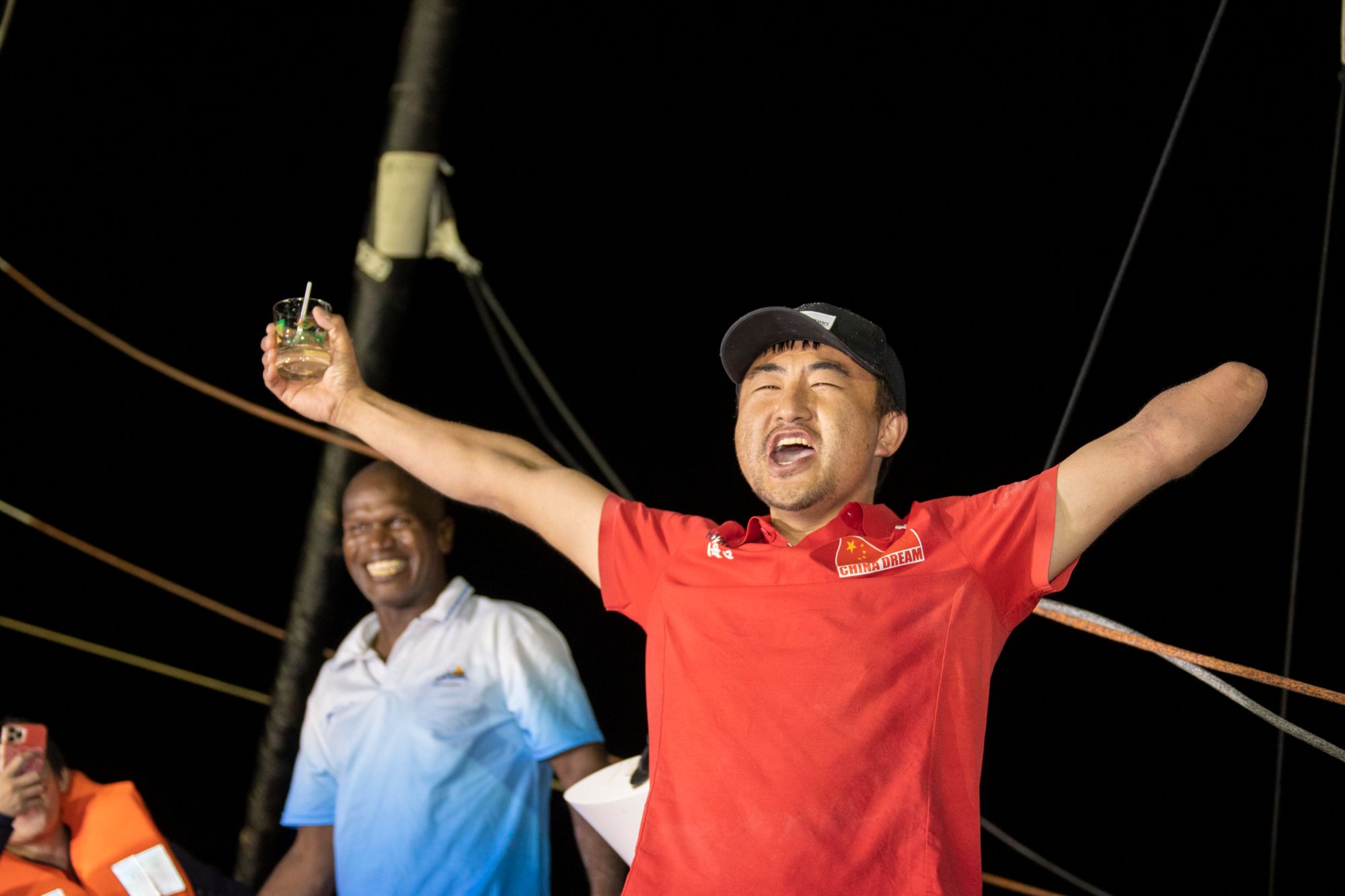 Jingkun Xu celebrates on the finish line of the Route du Rhum. Photo: Alexis Courcoux / #RDR2022